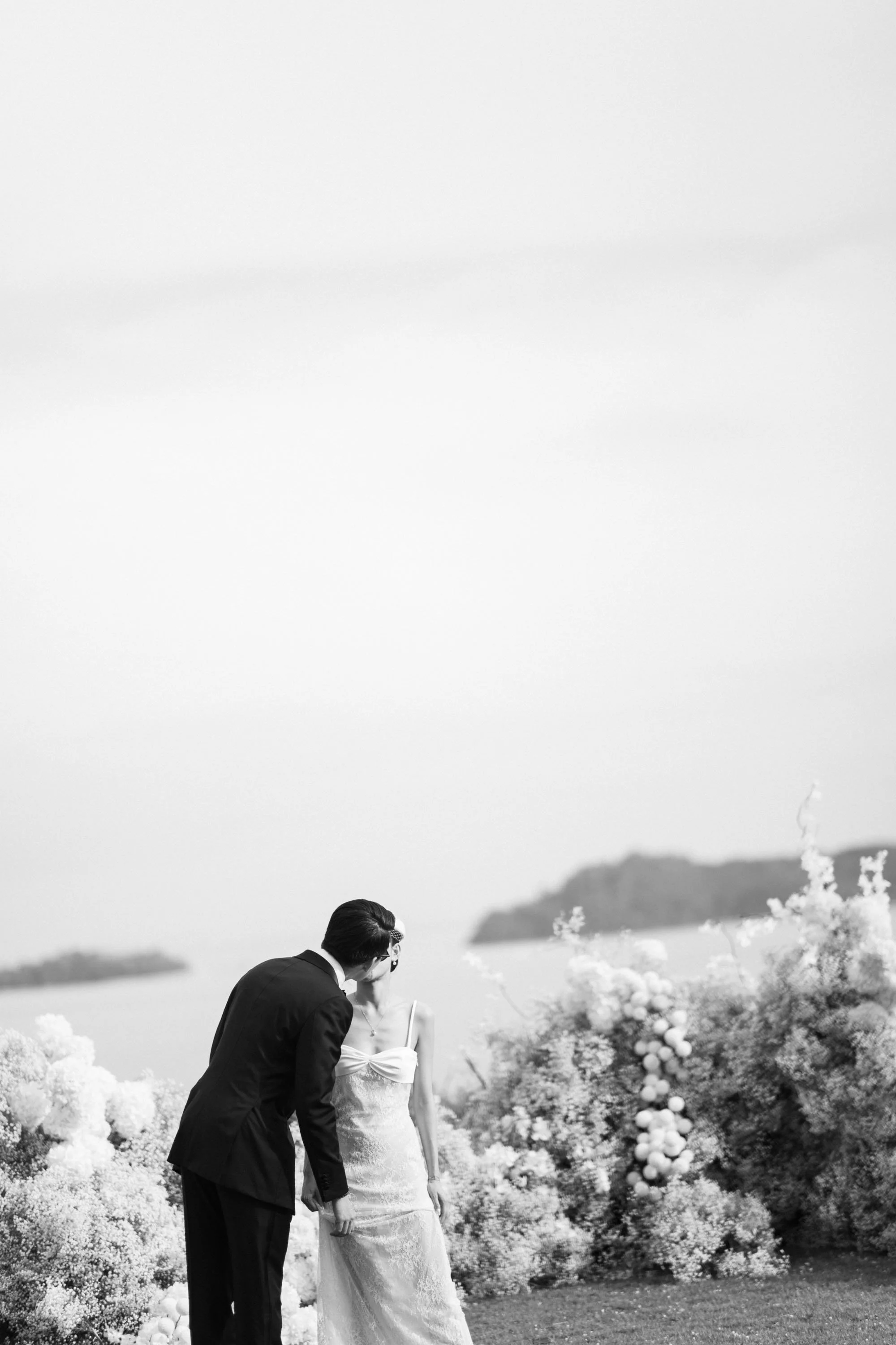 Bride and groom sharing a kiss after the wedding vows.