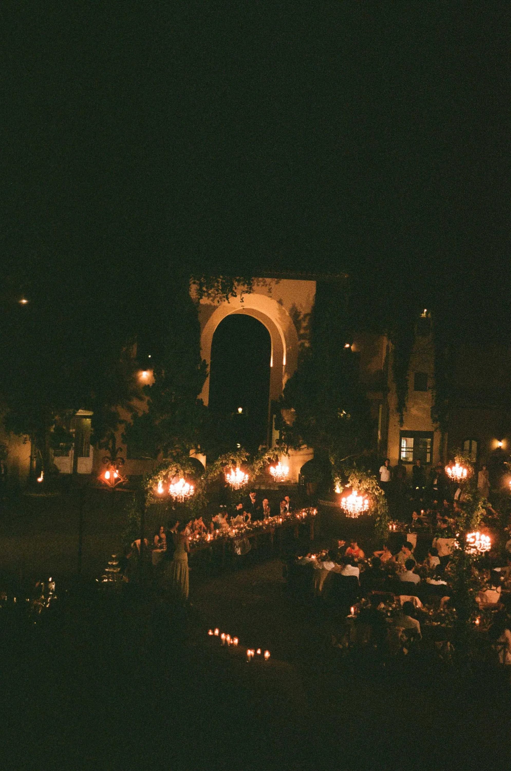 Romantic evening view of the wedding setting illuminated by lights.