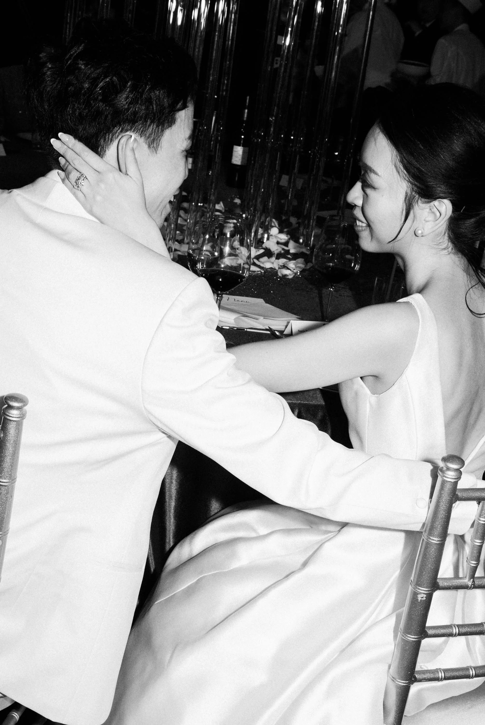 Bride and groom sharing a quiet moment together during the reception.
