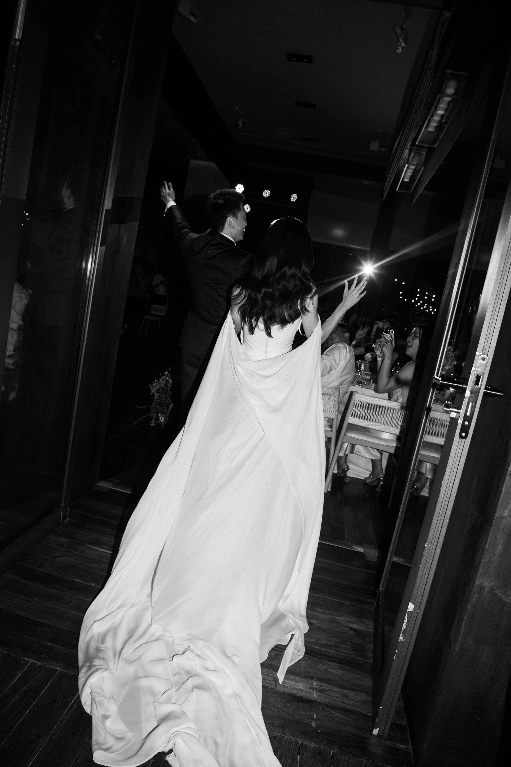Bride and groom making their entrance into the evening reception.