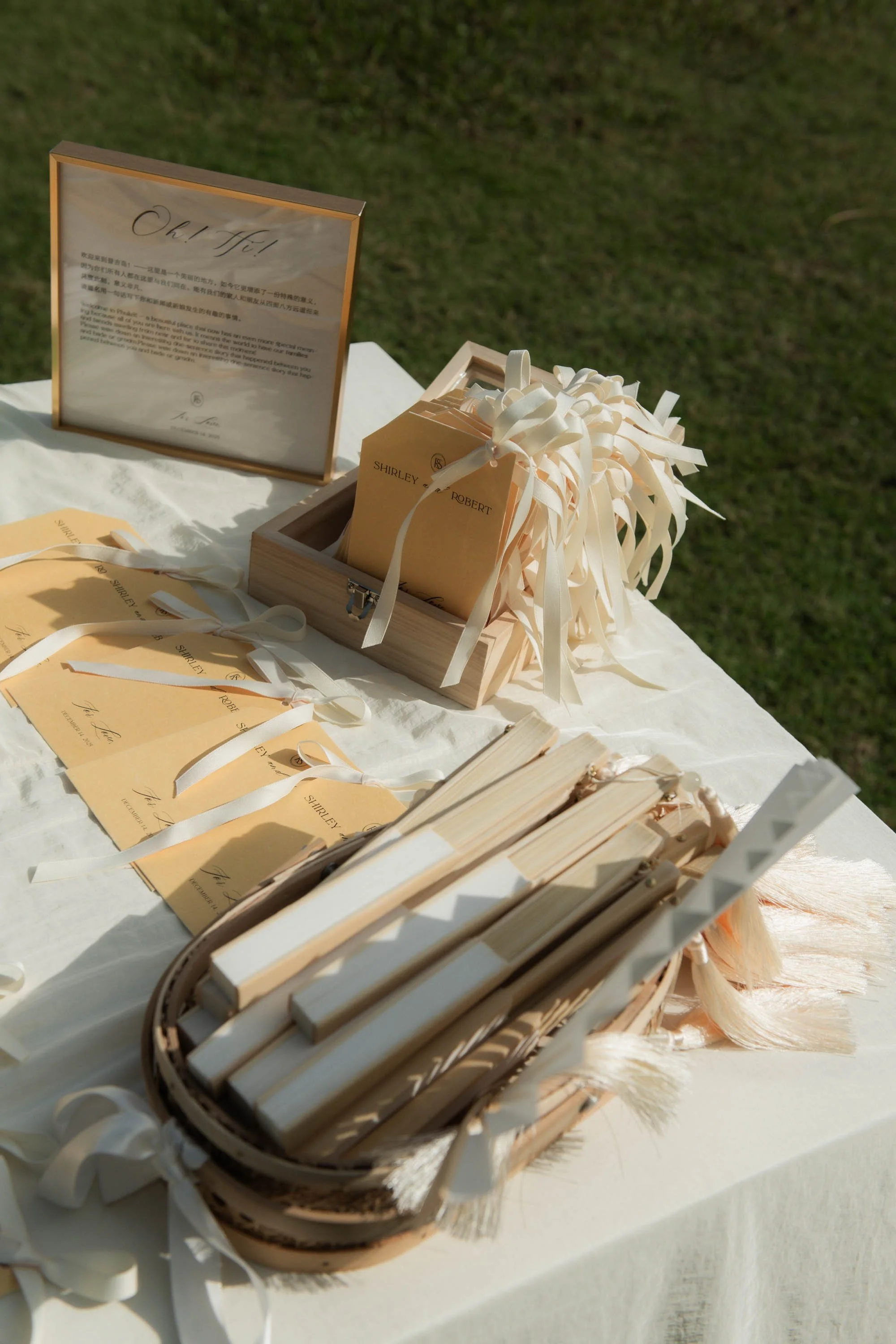 Wedding stationery and ceremony fans prepared for guests.