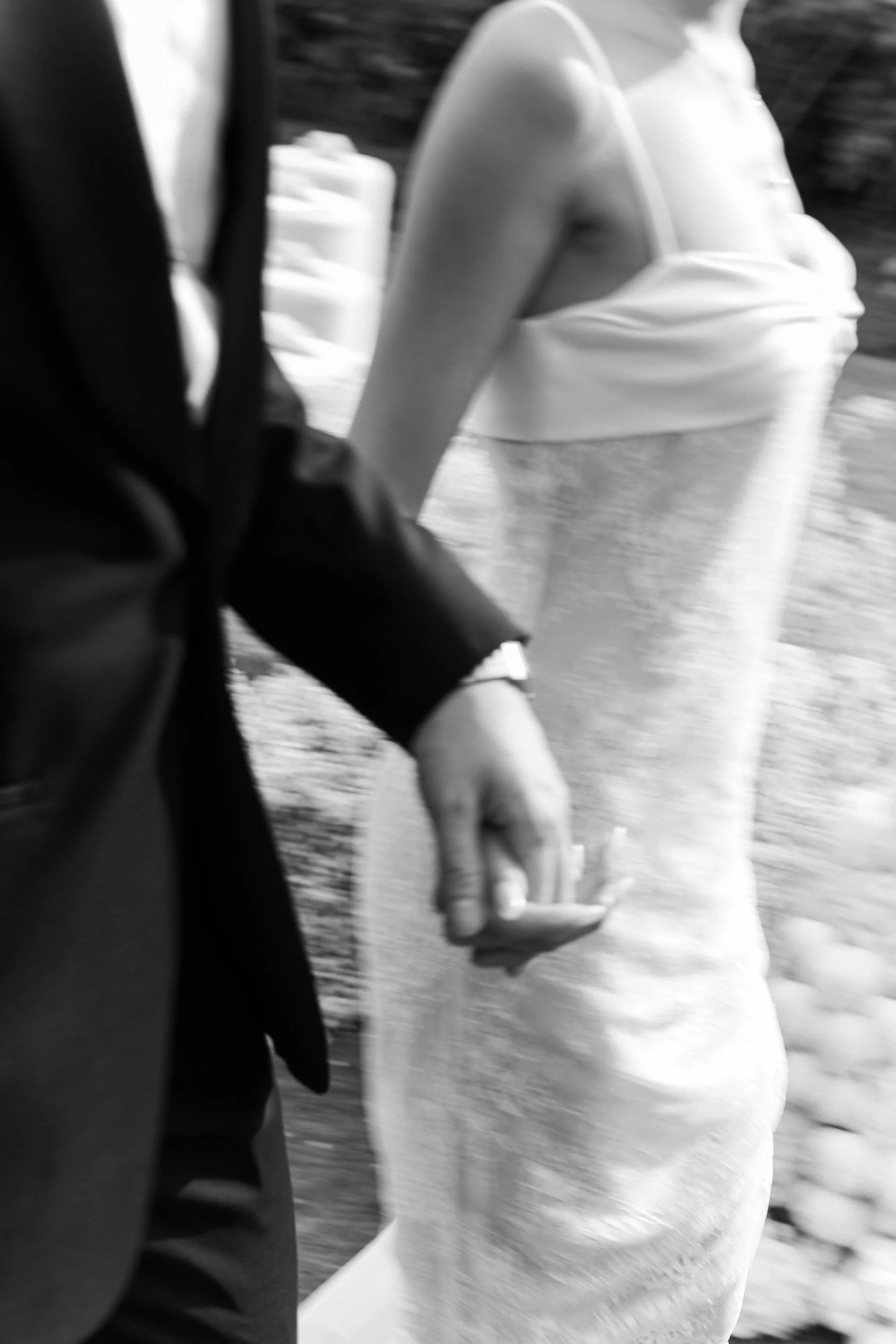 Close-up of the bride and groom holding hands after the ceremony.