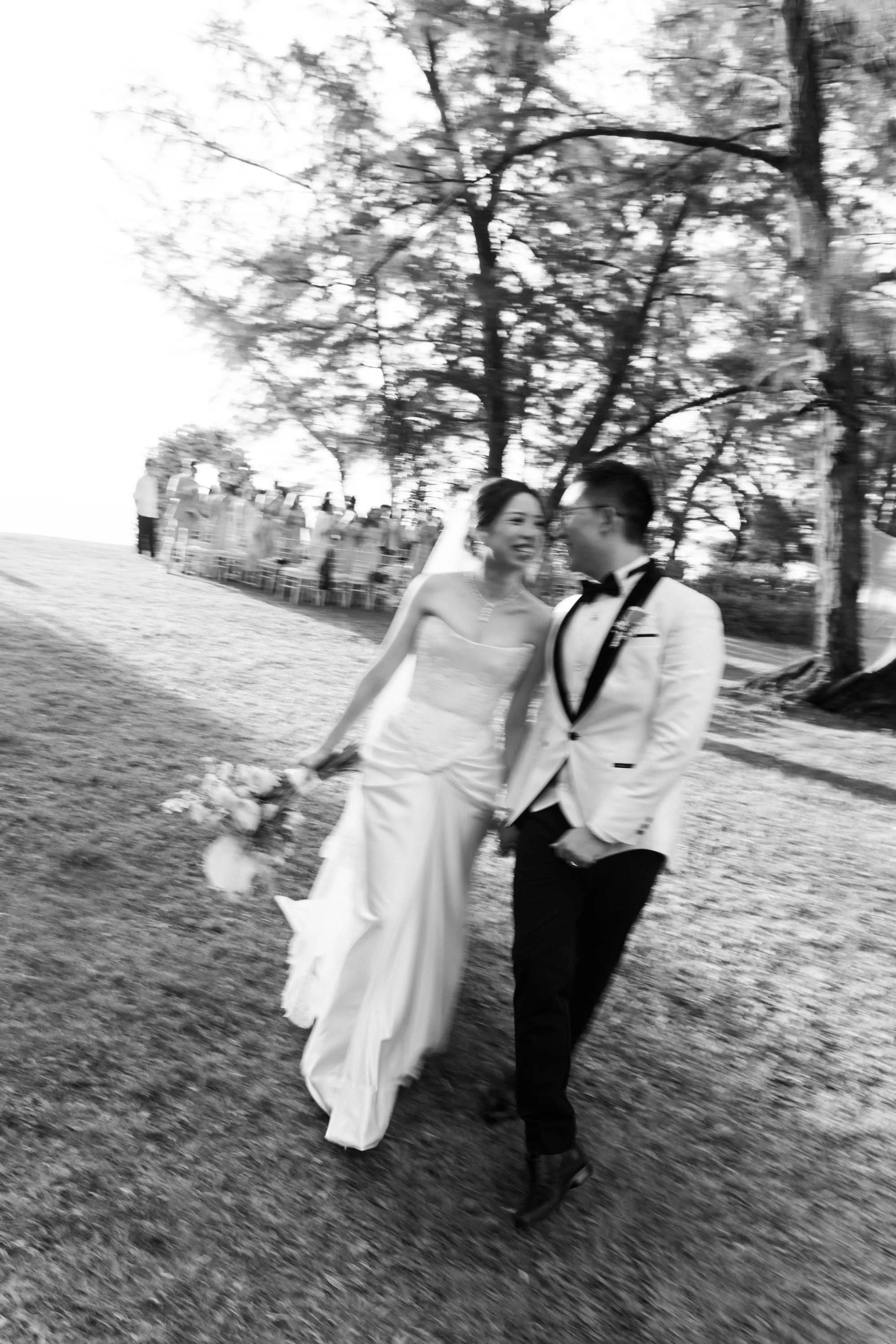 Bride and groom walking back down the aisle together after the ceremony.