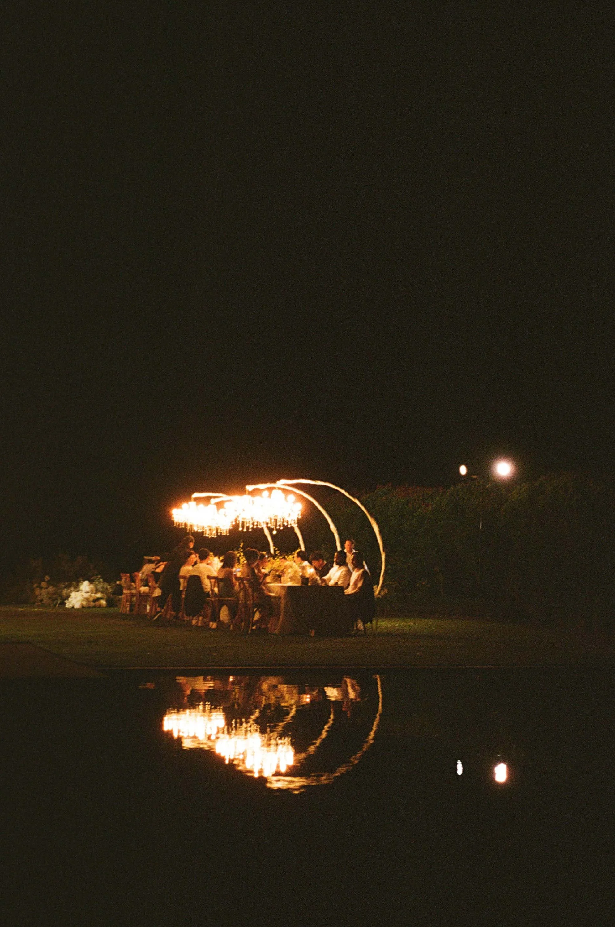 Outdoor dinner reception beneath the evening sky at COMO Point Yamu Phuket.