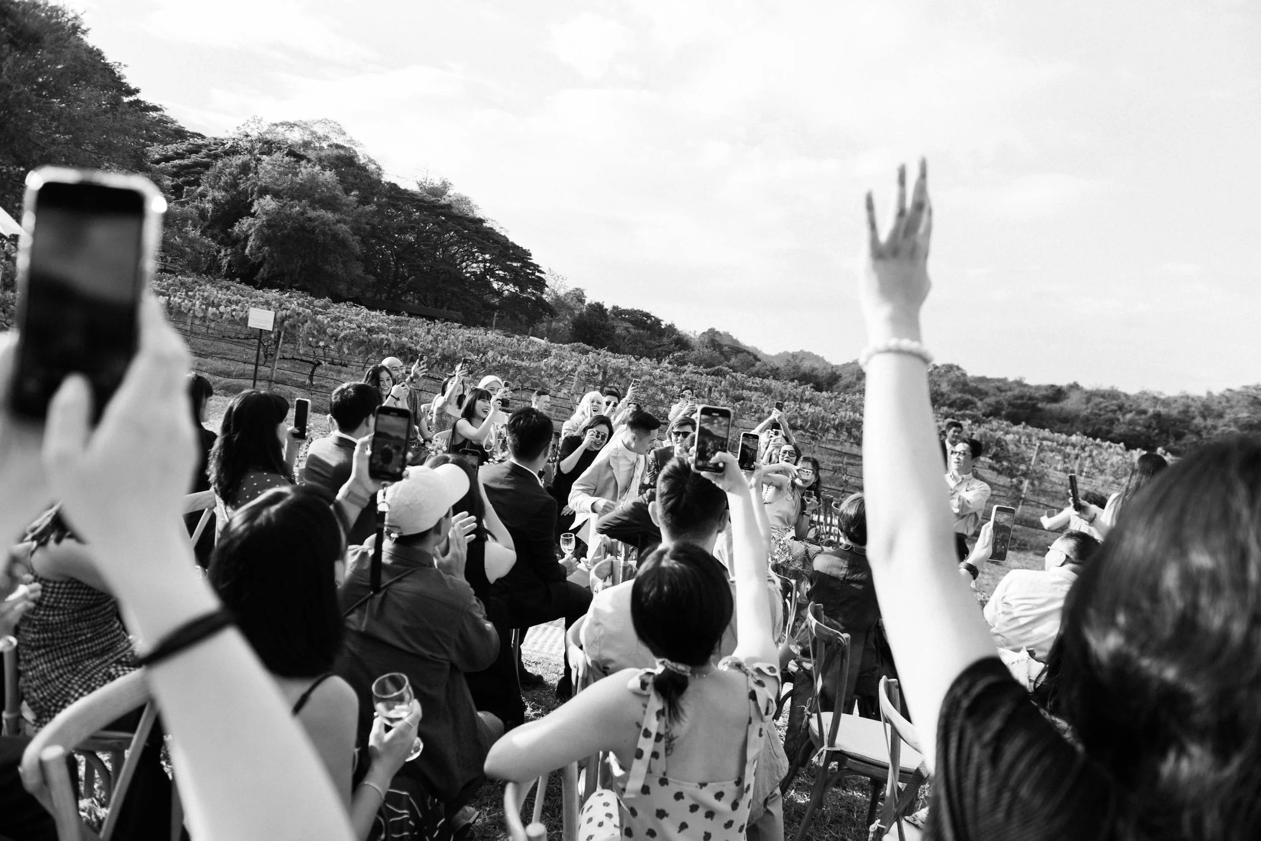 Groom walking through cheering guests during his entrance.