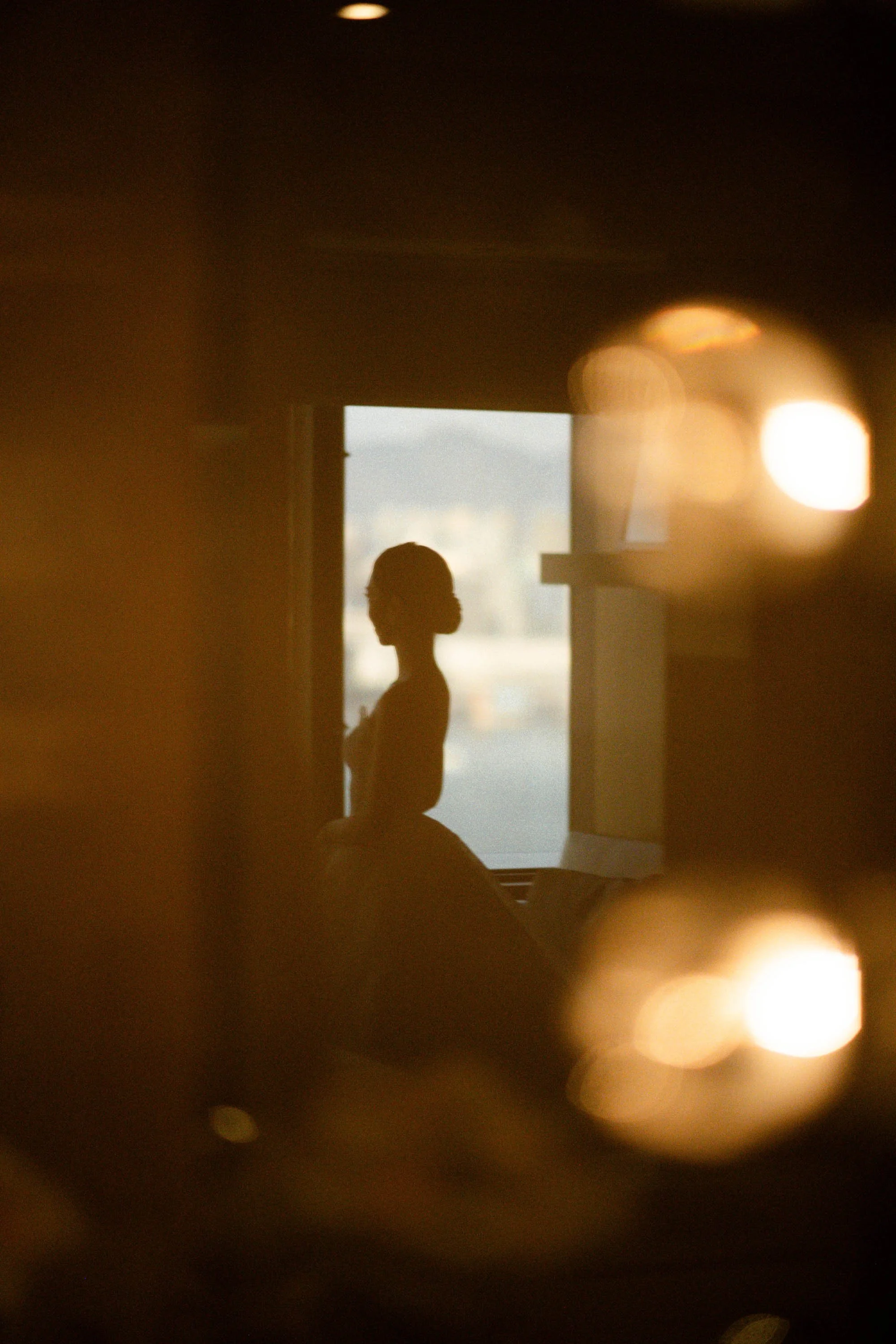 Bride reflected in the mirror after getting ready.