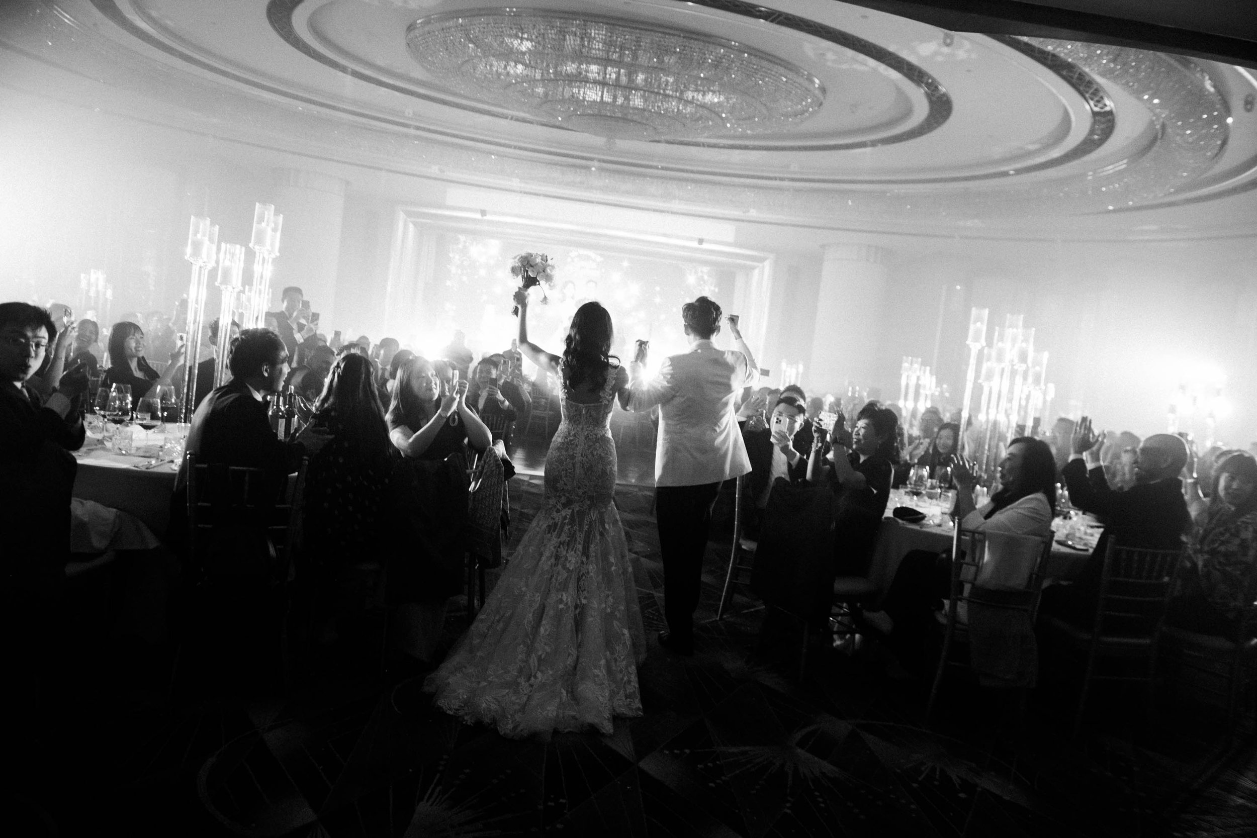 Bride and groom making their entrance into the wedding reception.