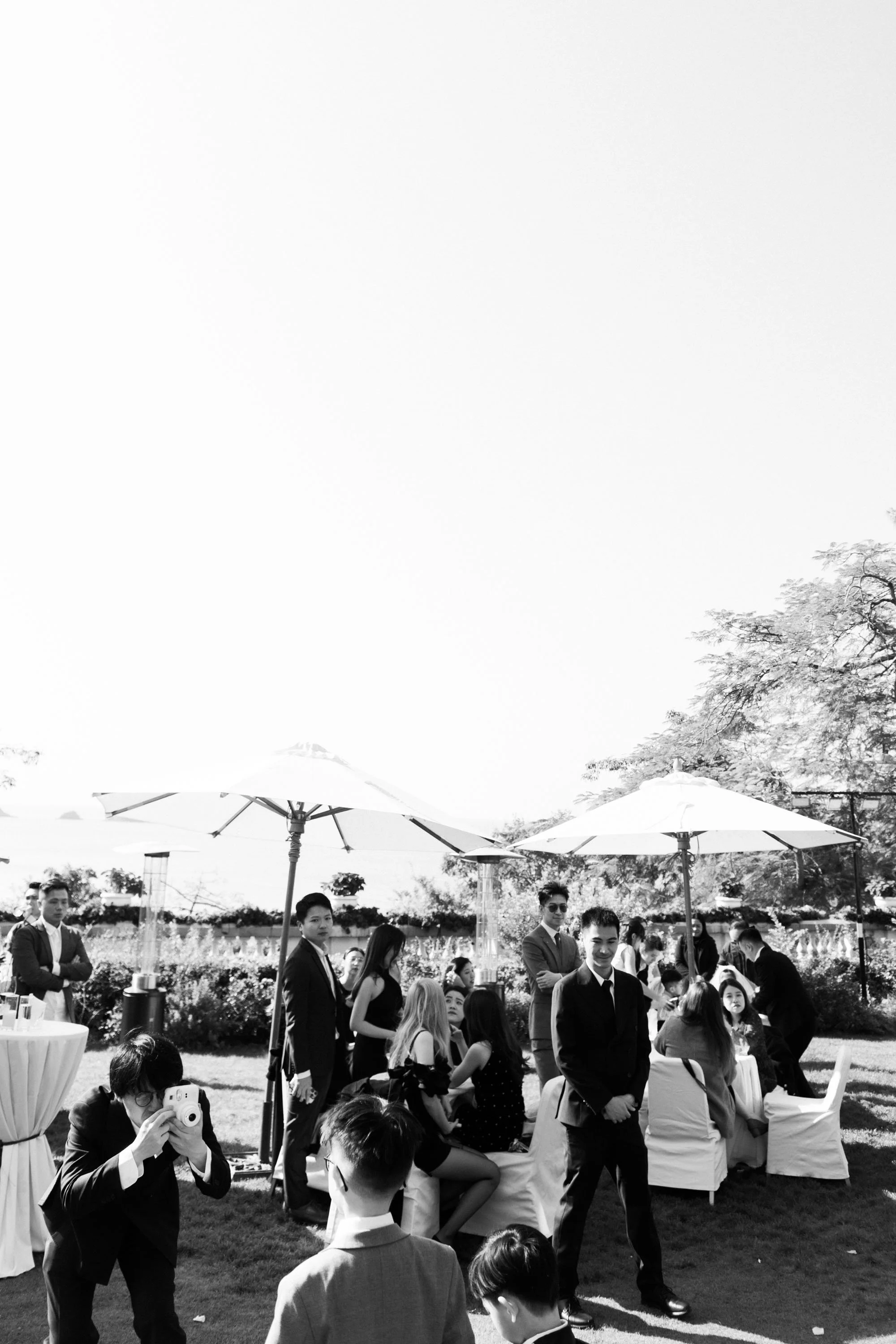 Guests gathering before the outdoor wedding ceremony.