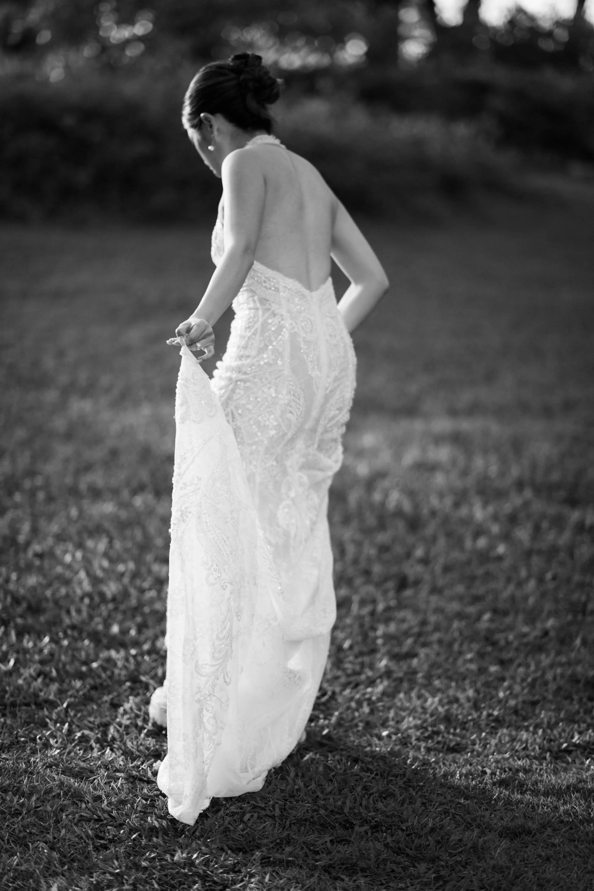 Bride adjusting her wedding dress after the ceremony.