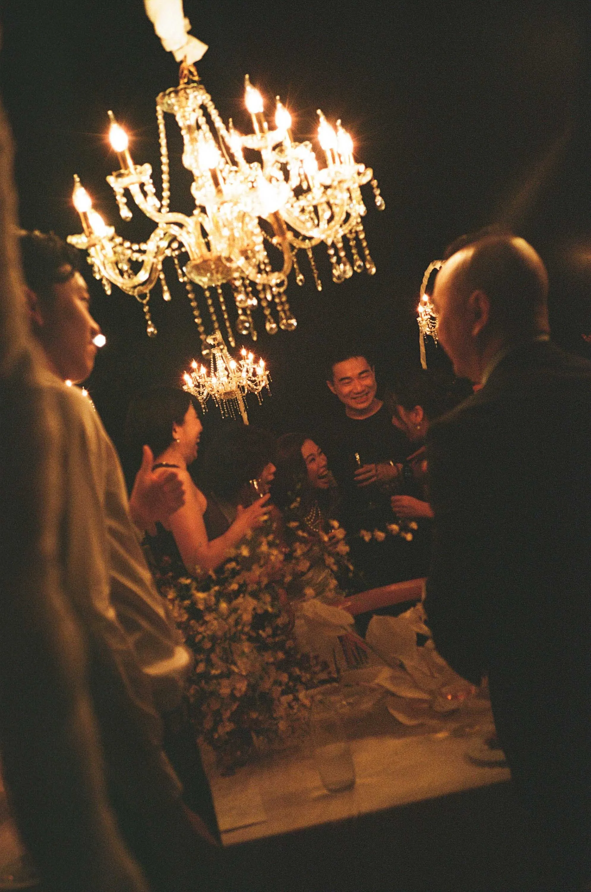 Bride laughing with friends and family during the reception.