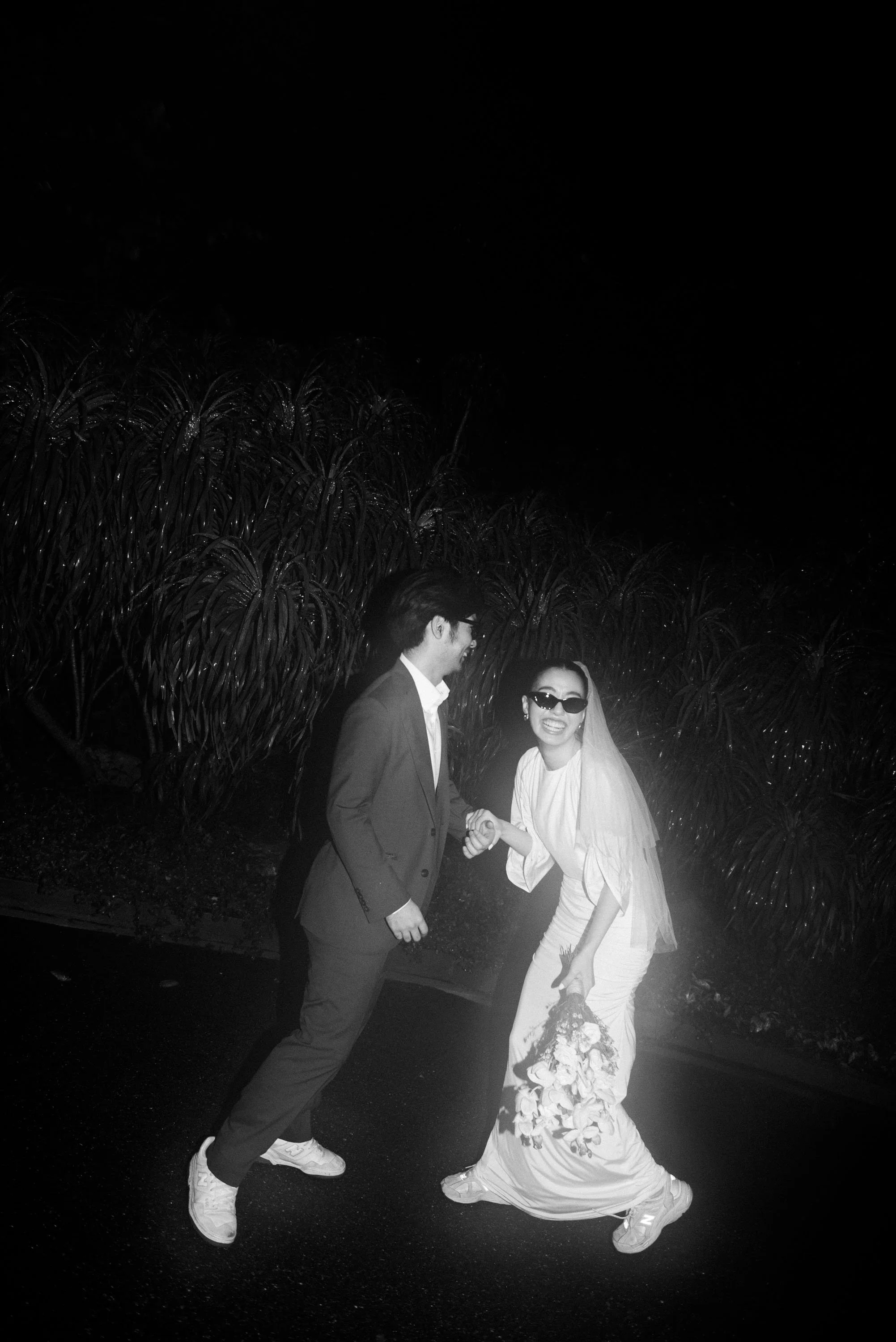 Couple laughing and talking together during a playful portrait session.