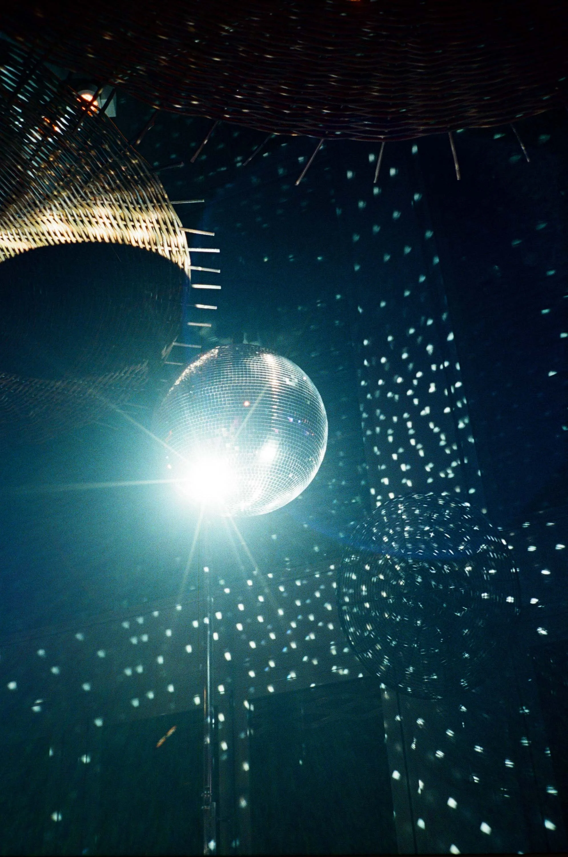 Disco ball reflecting light during the after-party.