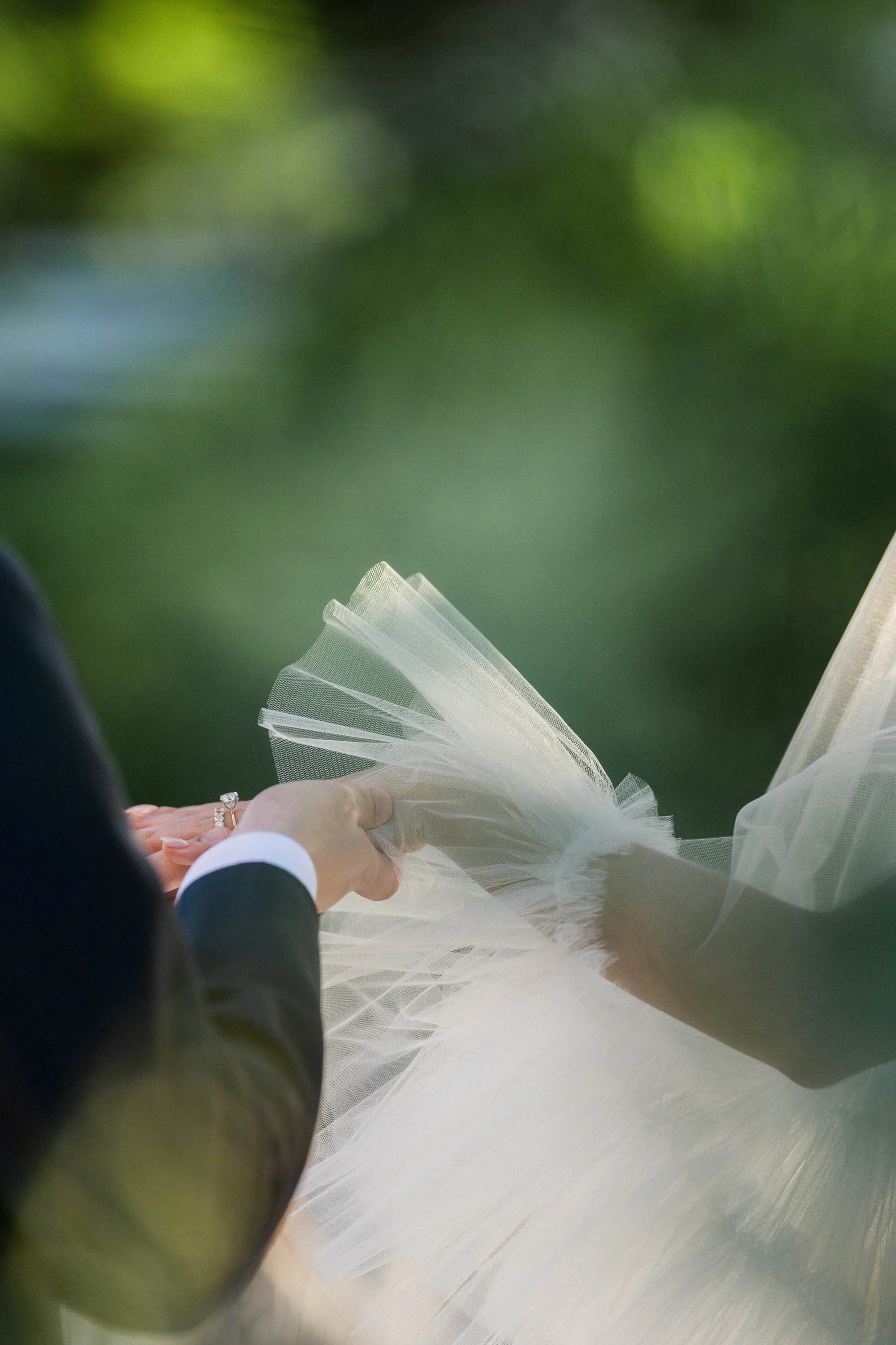 Close-up of the couple exchanging wedding rings.