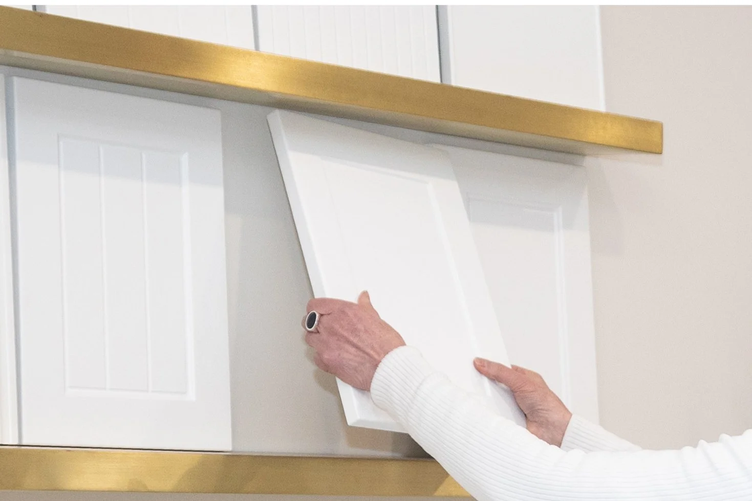 Carrolls designer comparing cabinetry door profiles and finishes.