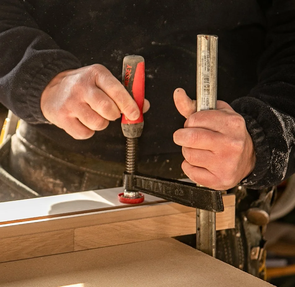 Carrolls craftsperson assembling timber joinery by hand in the workshop.