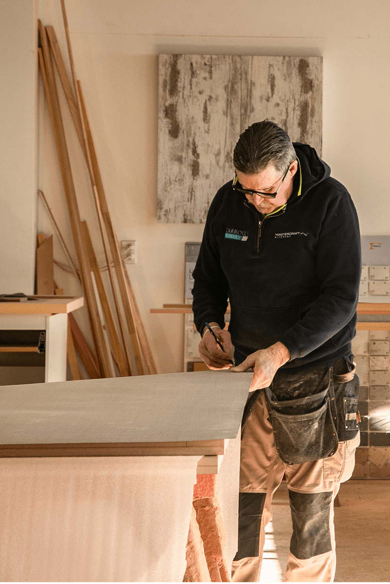 Carrolls craftsperson marking out a panel in the timber workshop.