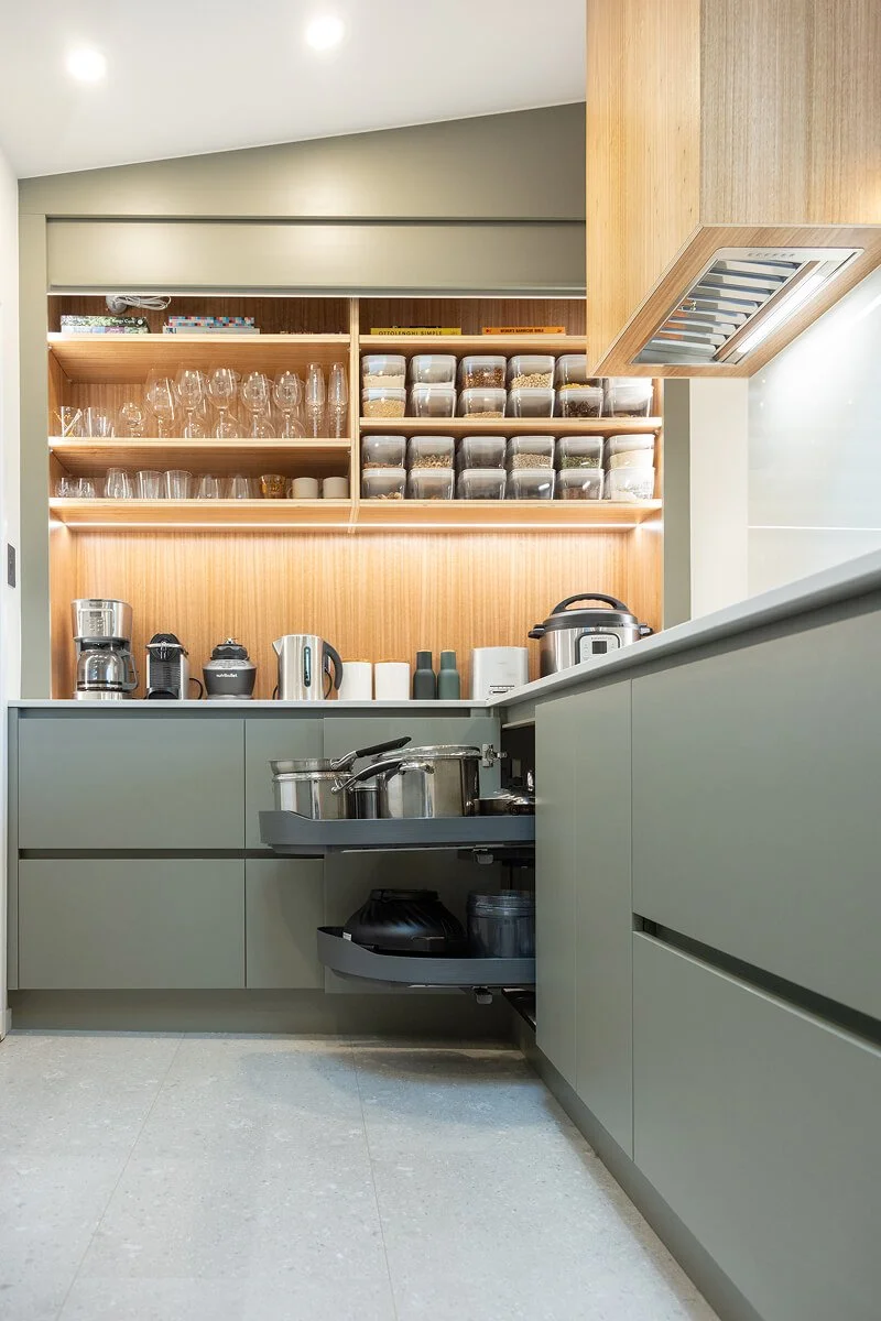 Kitchen corner storage with pull-out shelves for pots and pans.