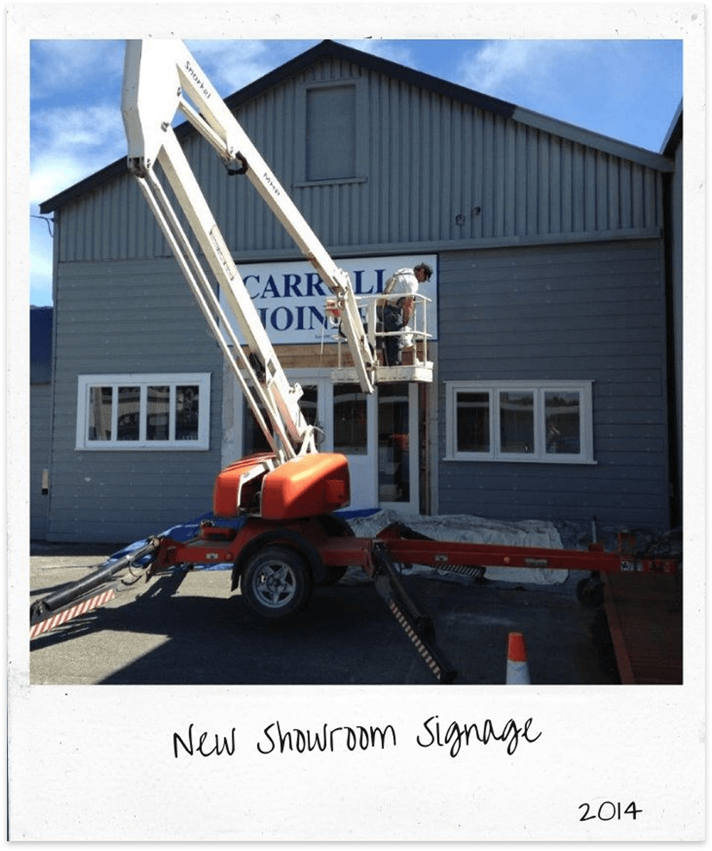 New Carrolls showroom signage being installed in Masterton in 2014.