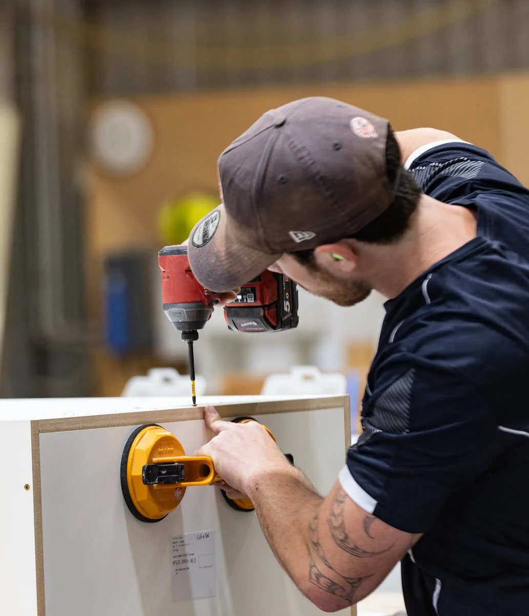 Carrolls cabinetmaker assembling bespoke cabinetry in the Masterton workshop.