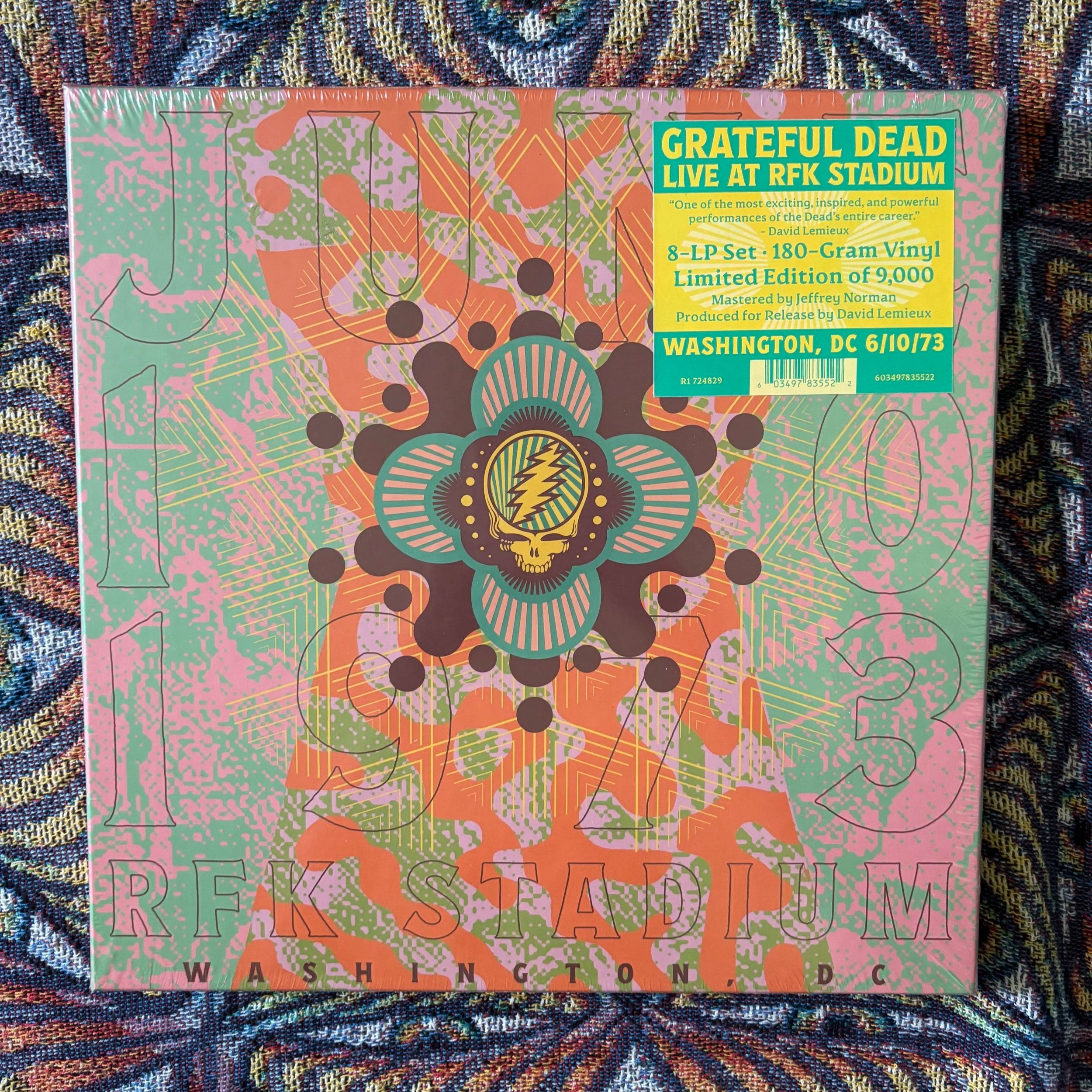 Album cover art for the Grateful Dead live recording at RFK Stadium with colorful abstract patterns and the band's logo featuring a lightning bolt inside a skull.