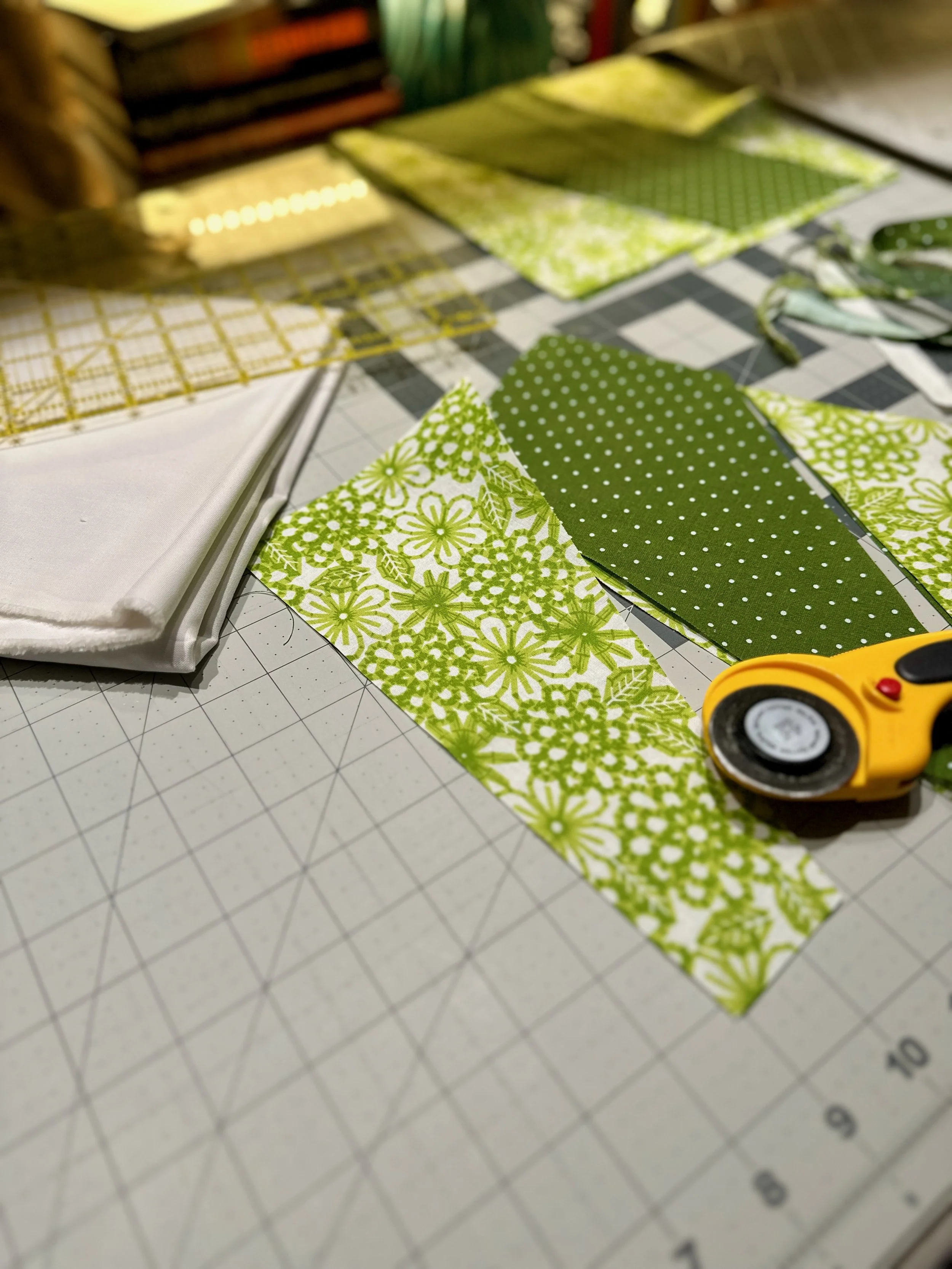 Fabric cutouts for the panes of glass 
blocks of the Verdure rag quilt, in 
progress at Nicollet's Place studio 
in Altadena, California.