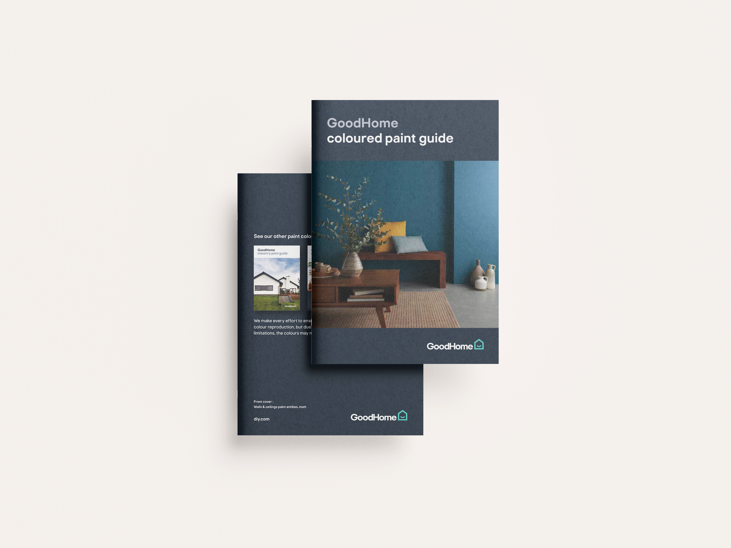 Brochure for GoodHome's colored paint guide, featuring a living room with blue walls, a wooden table with vases, and decorative pillows.