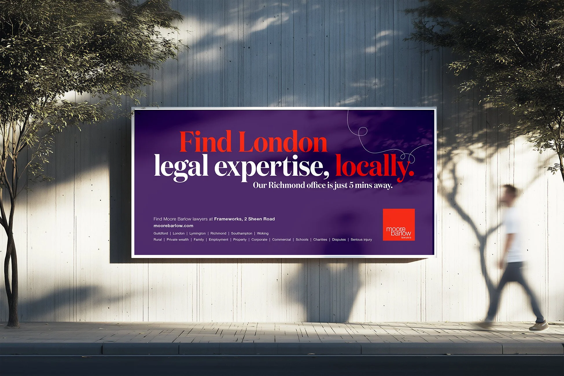 Billboard advertising a London-based law firm, Moore Barlow. The billboard has a purple background with red and white text. It reads, 'Find London legal expertise, locally.' Below, address details and a website URL are provided, along with a list of legal services and areas of practice.