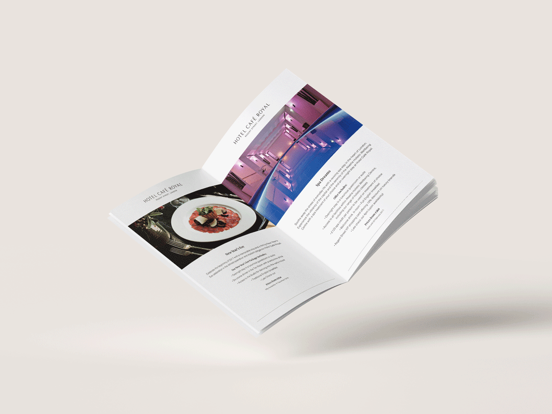 Open brochure with images of a plated gourmet dish and a modern hotel interior
