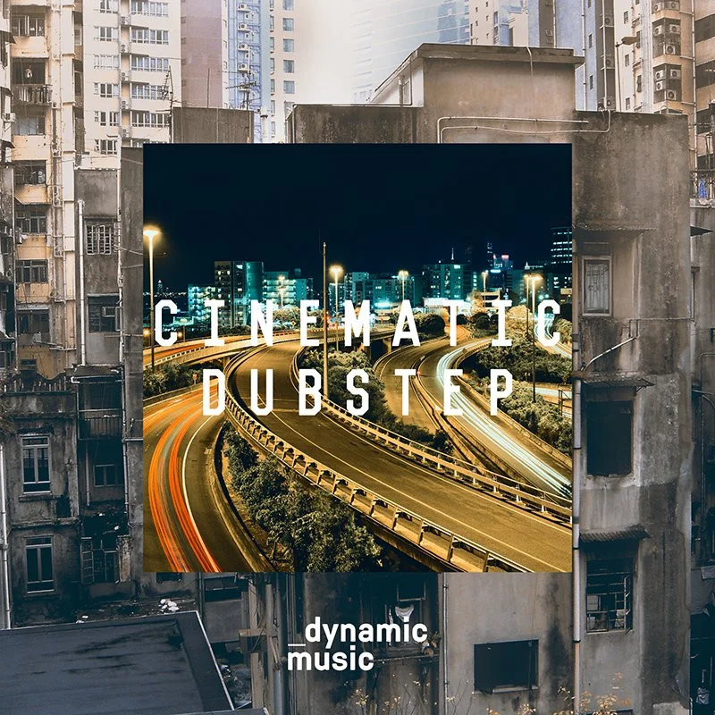 Billboard advertisement for 'Cinematic Dubstep' with a city highway at night, surrounded by tall, aged apartment buildings.