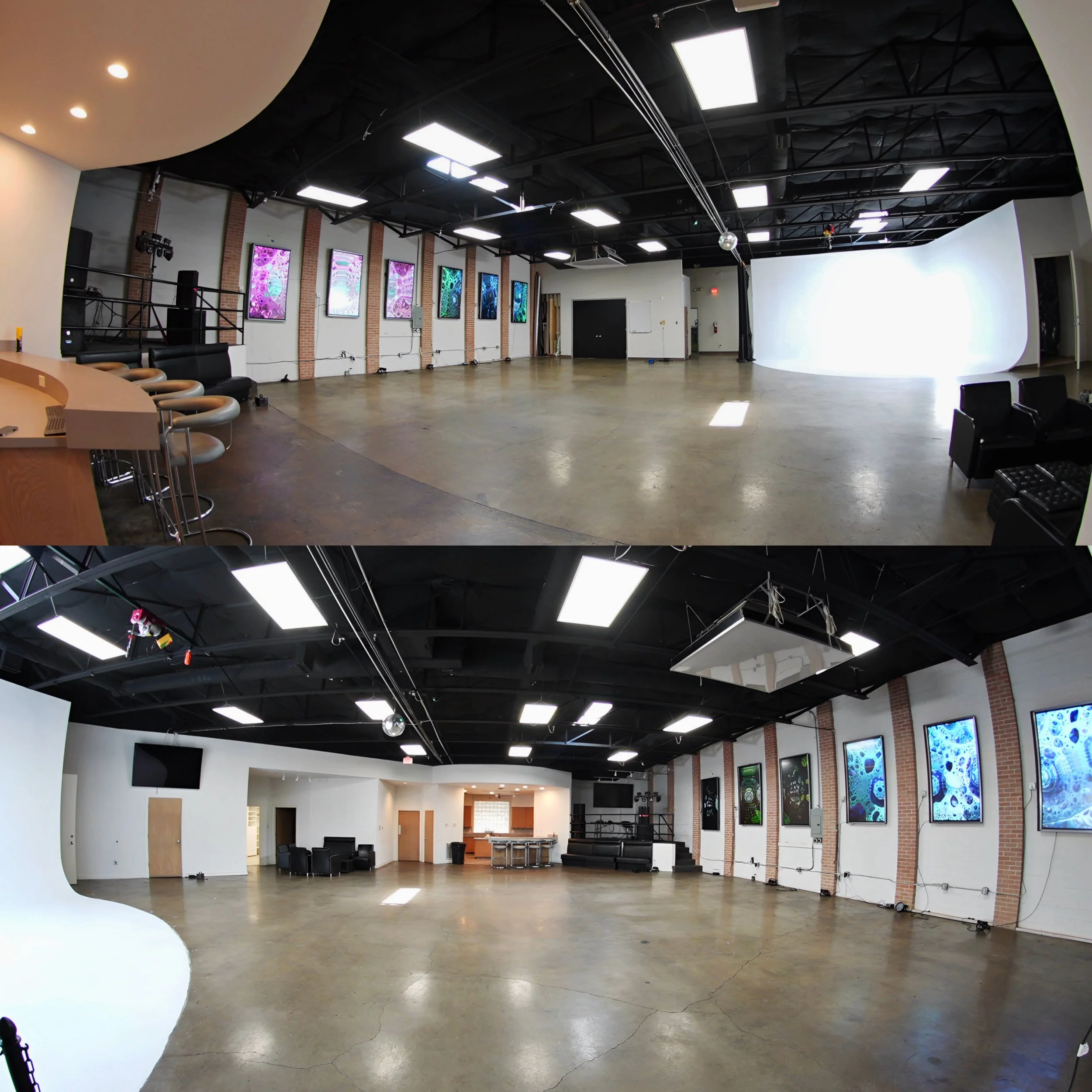 Empty art gallery or exhibition space with a curved white wall, multiple flat-screen monitors displaying digital art or abstract images, black chairs arranged in seating areas, and spotlights on the ceiling illuminating the room.