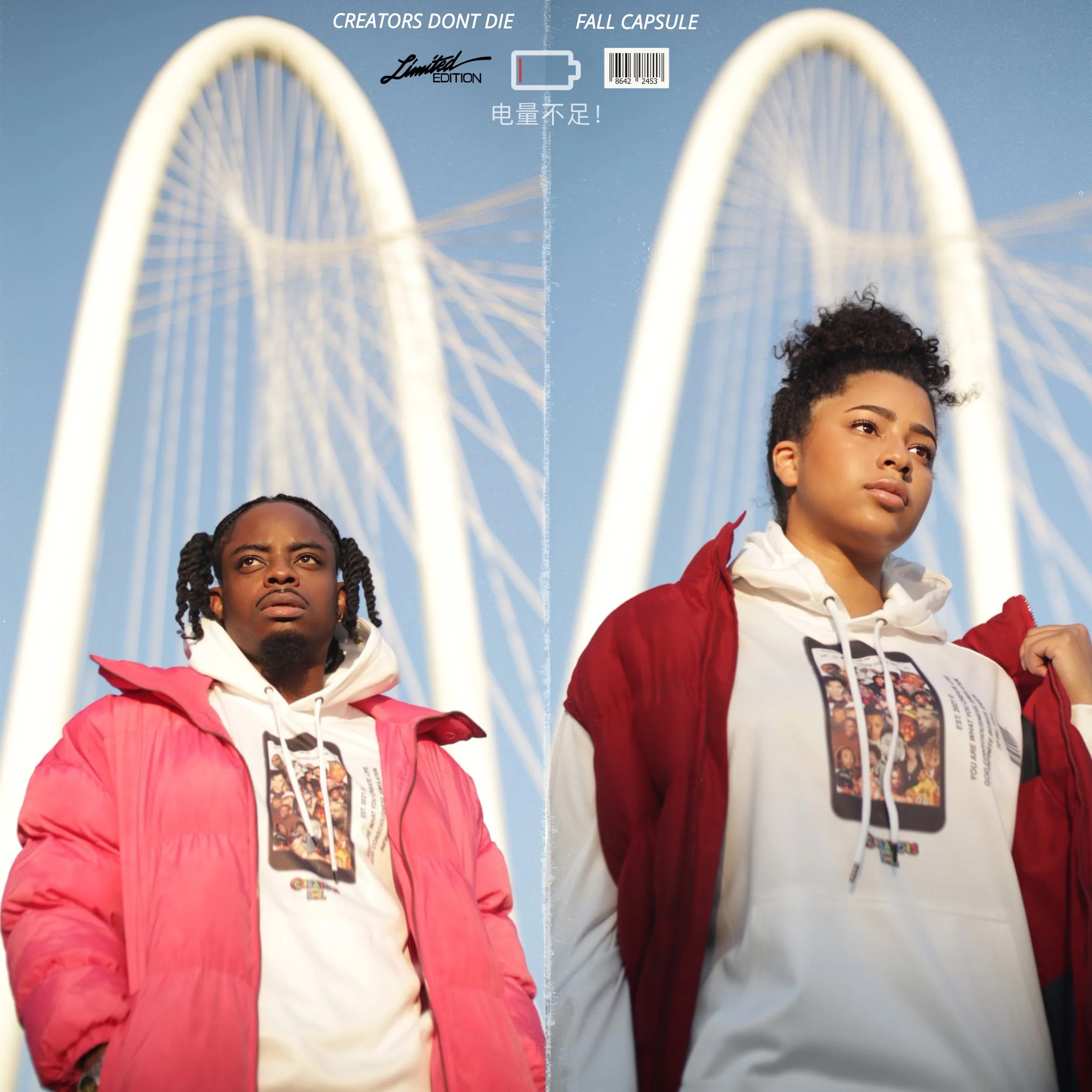 Two young women standing outdoors against a bright blue sky, wearing jackets and hoodies, with a bridge structure behind and above them. The woman on the left has braided hair and is wearing a pink jacket, while the woman on the right has curly hair and wears a red jacket with a hoodie.