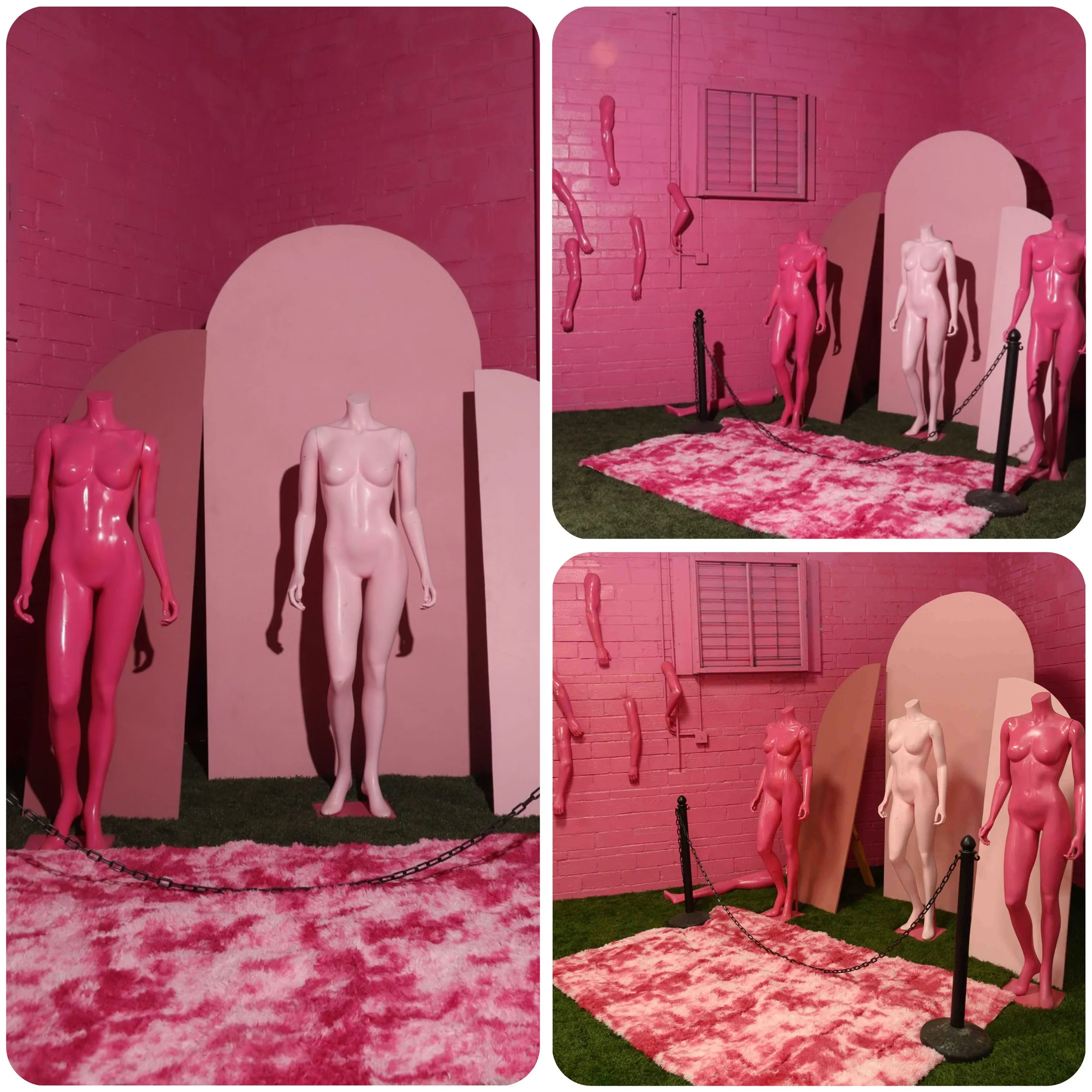 Art installation with mannequins of female torsos in pink, light pink, and dark pink colors, positioned on pink fluffy carpets against a pink brick wall. Some mannequins are full-body, while others are torso-only. Chain barriers surround the display.