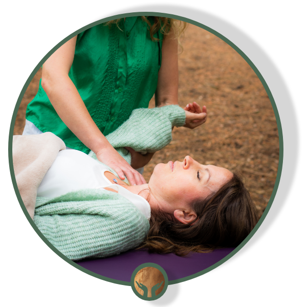 Sam Lowi cradling a student’s head during craniosacral therapy training