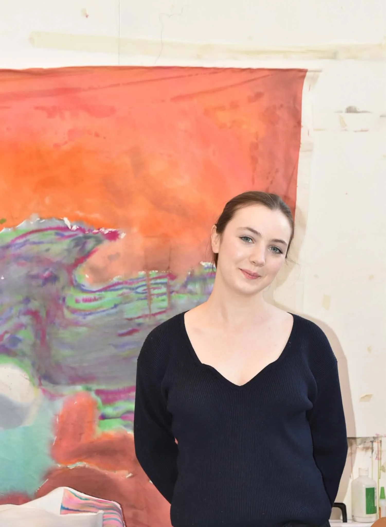Contemporary artist Annabelle Pelaez with her painting at the Edinburgh College of Art Graduate Show 2025.