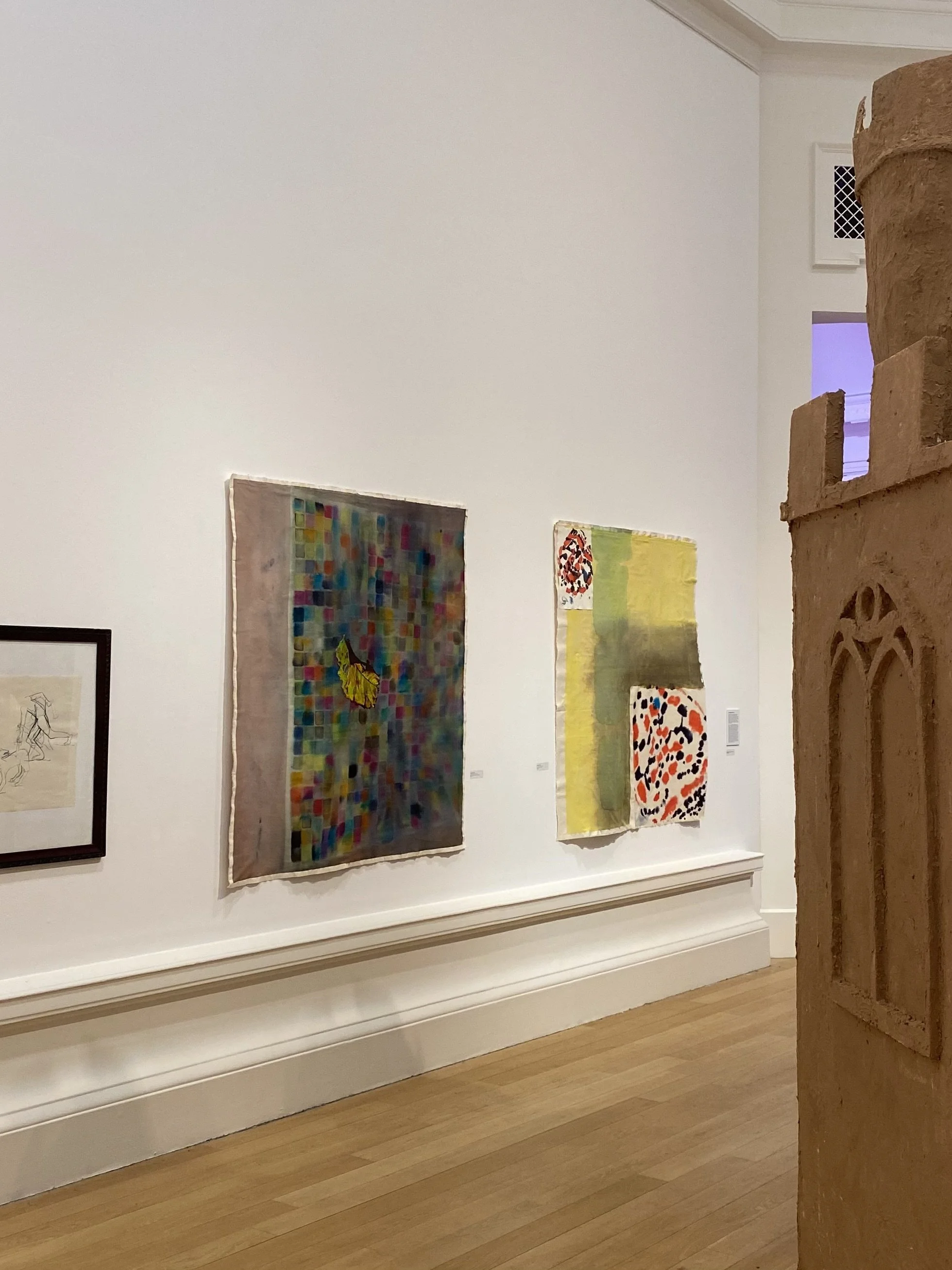Installation view of Annabelle Pelaez's paintings 'Pavement Prisms' and 'Crimson Speckled' at the Royal Scottish Academy exhibition.