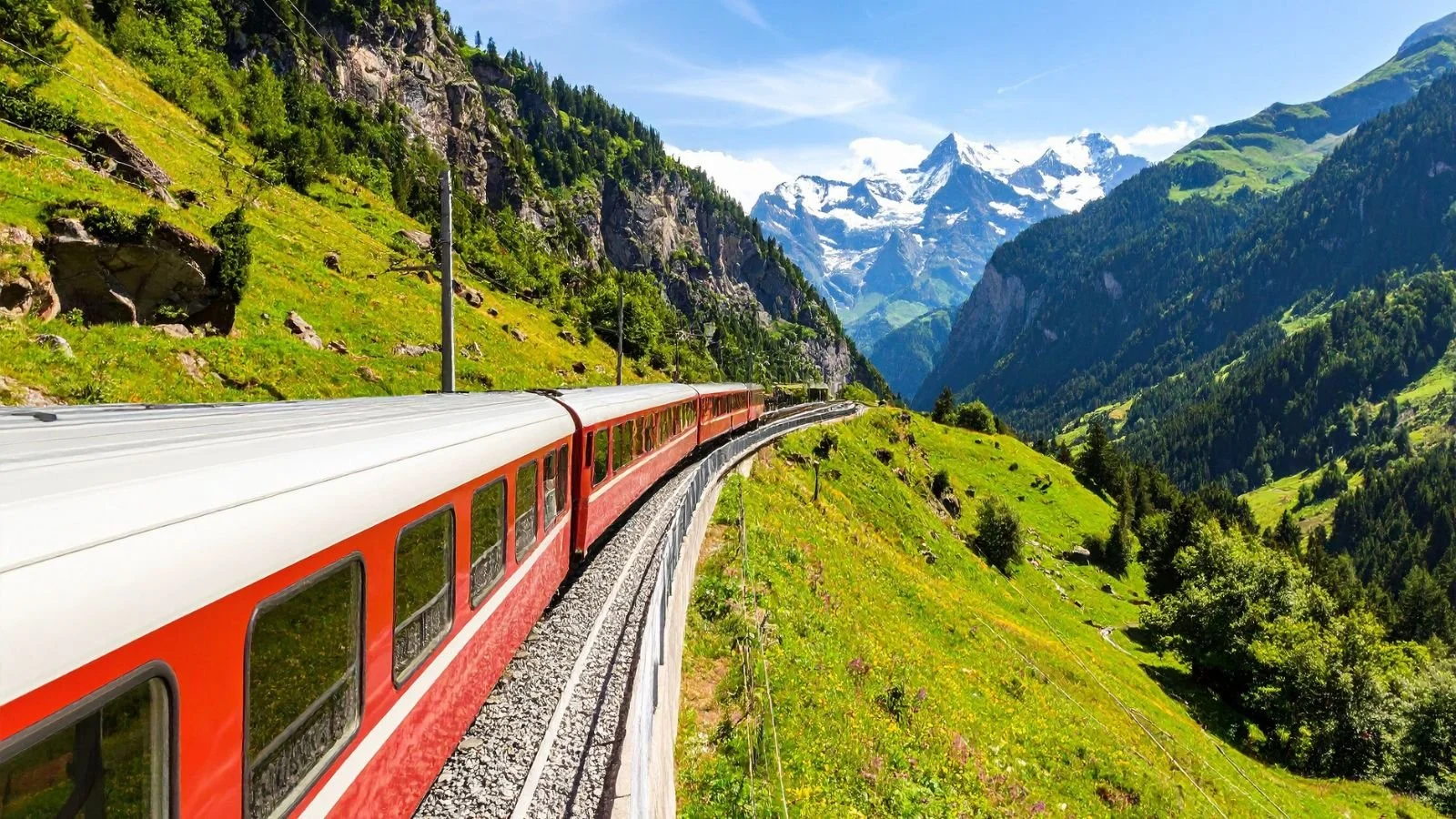 Scenic train traveling through the Swiss Alps, illustrating how transportation choices affect the overall value of a vacation.