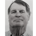 Black and white portrait of an elderly man with short hair, wearing a collared shirt.