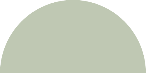 A large, pale green semi-circle on a black background.