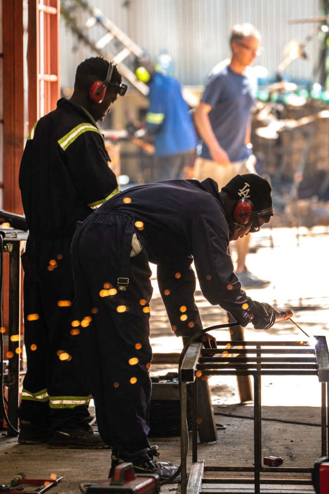 Two Tanzanian construction workers at a construction site.