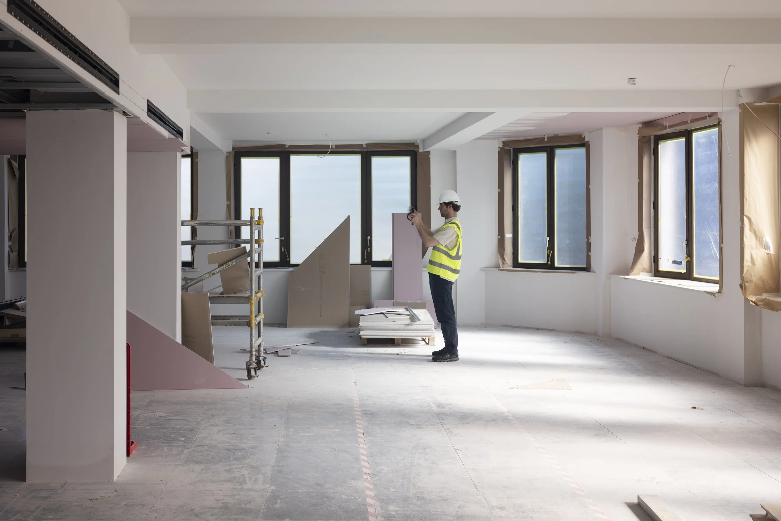 Building interior with window bays and marked concrete floor being assessed during a Finch Audits survey