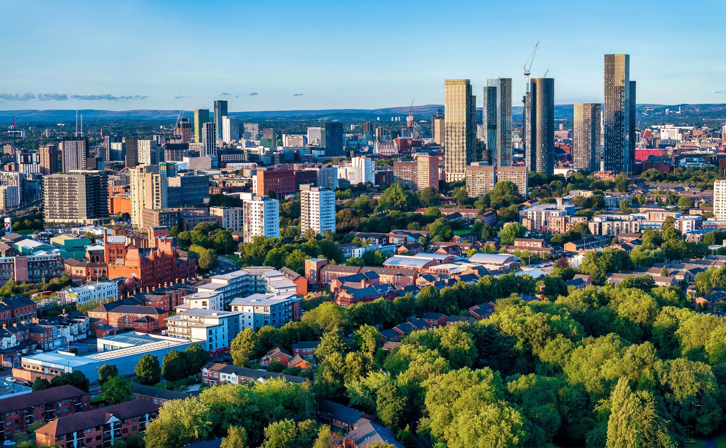 Aerial view of a UK city skyline representing Finch Audits' building audit services for pre-demolition and pre-refurbishment projects