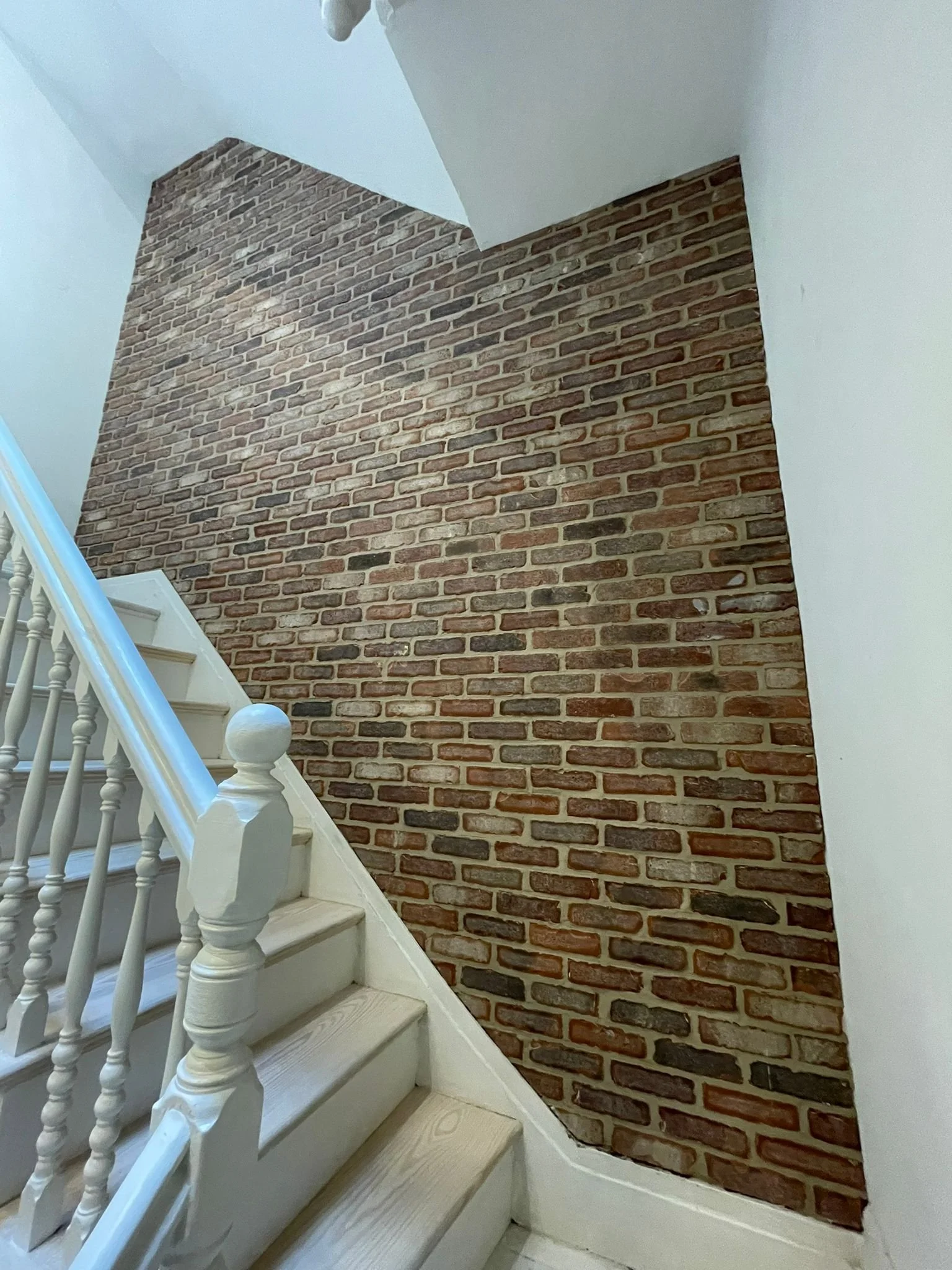 Brick veneer installation to stair wall