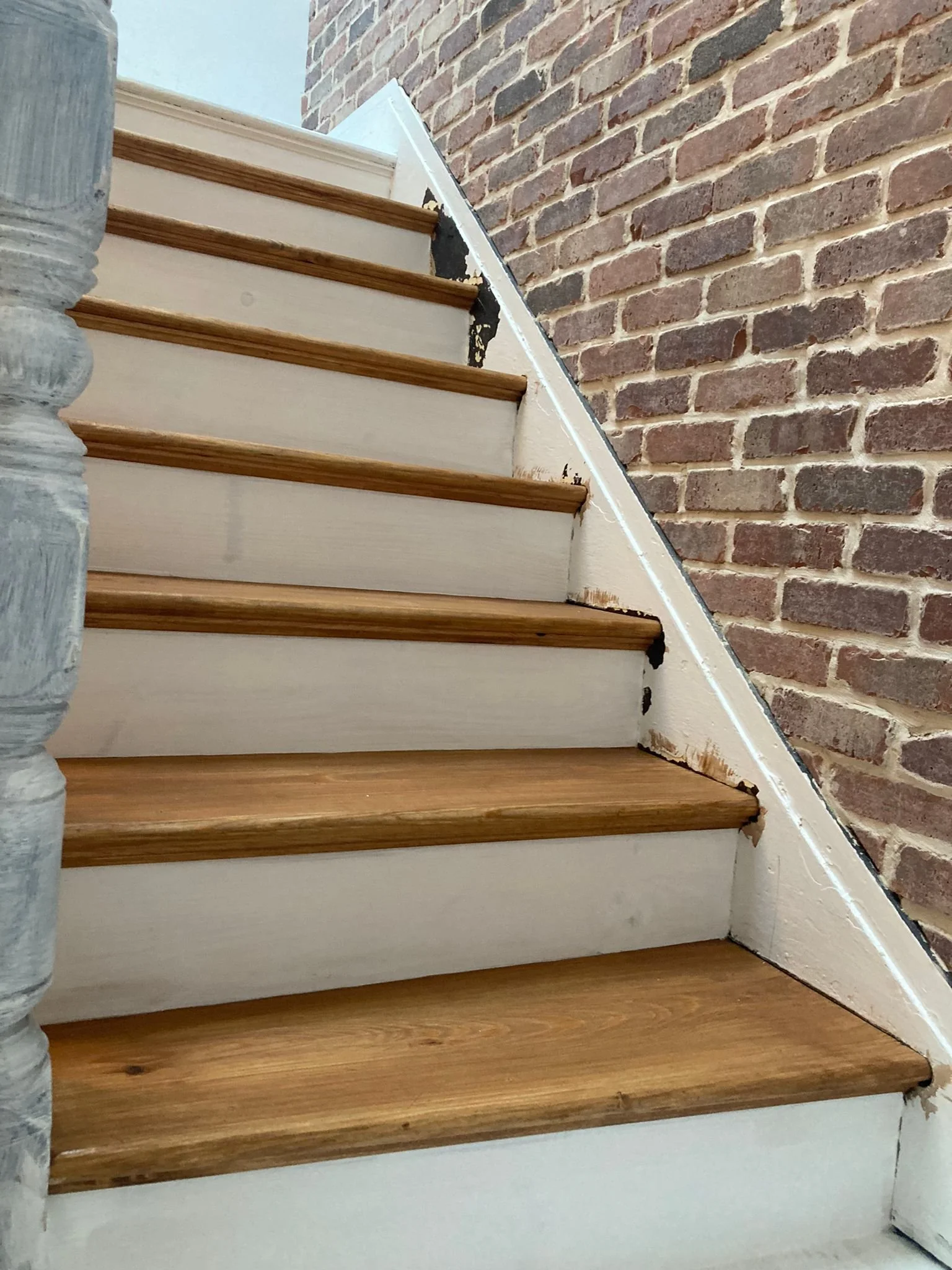 Brick veneer installation to stair wall