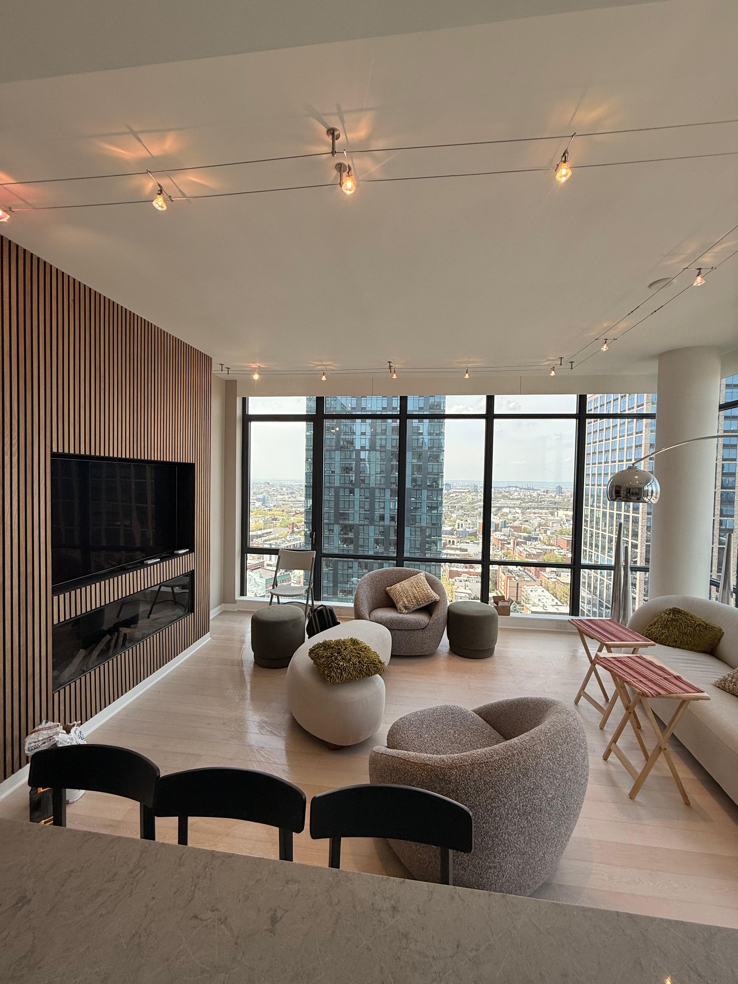 Specialty cable lighting installation and custom fireplace/TV area with wood paneling