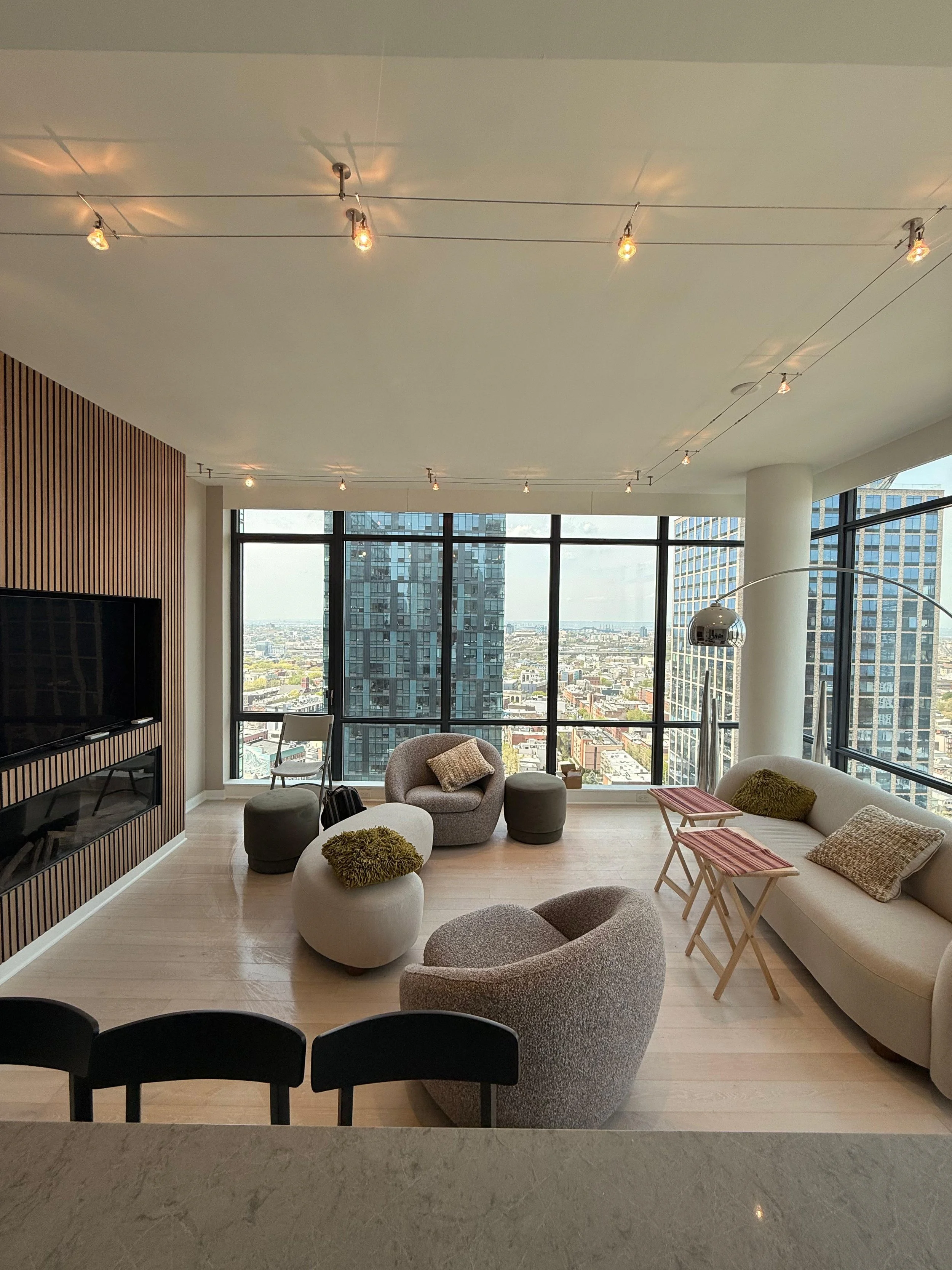 Specialty cable lighting installation and custom fireplace/TV area with wood paneling