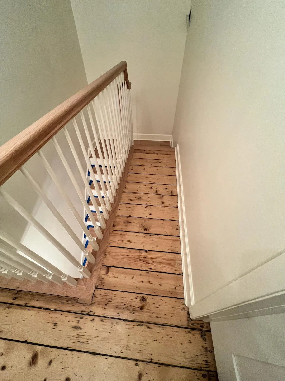 Restored historic stairs, railing and balusters and restored original hardwood floors