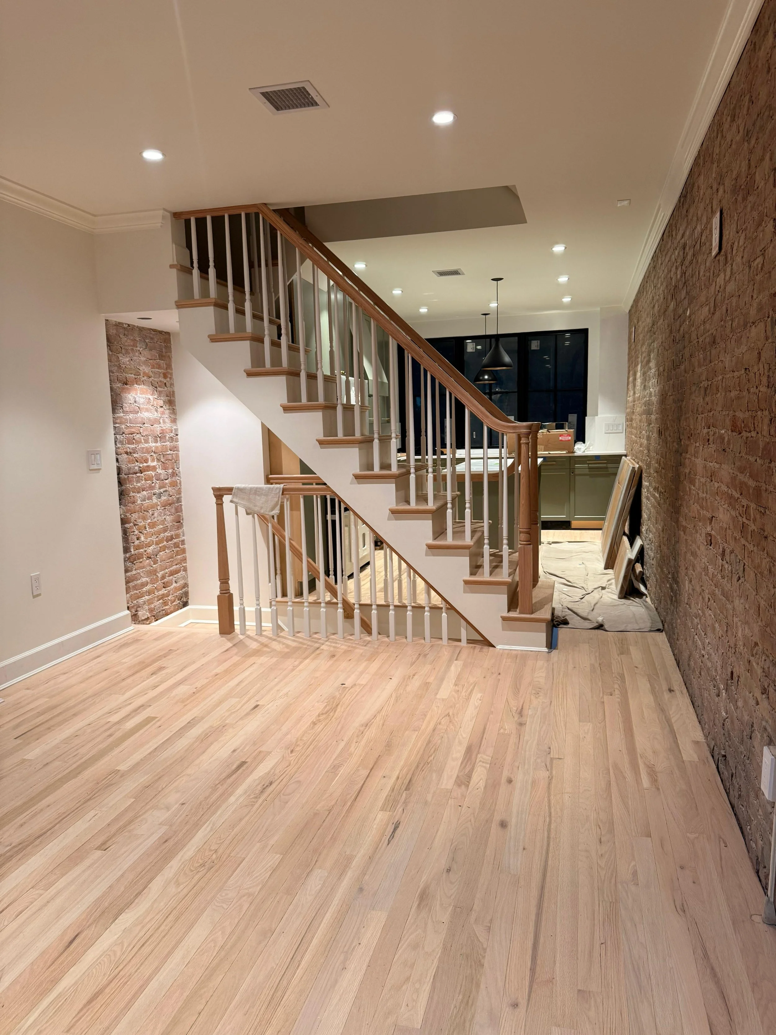 Restored historic stairs and hardwood flooring installation