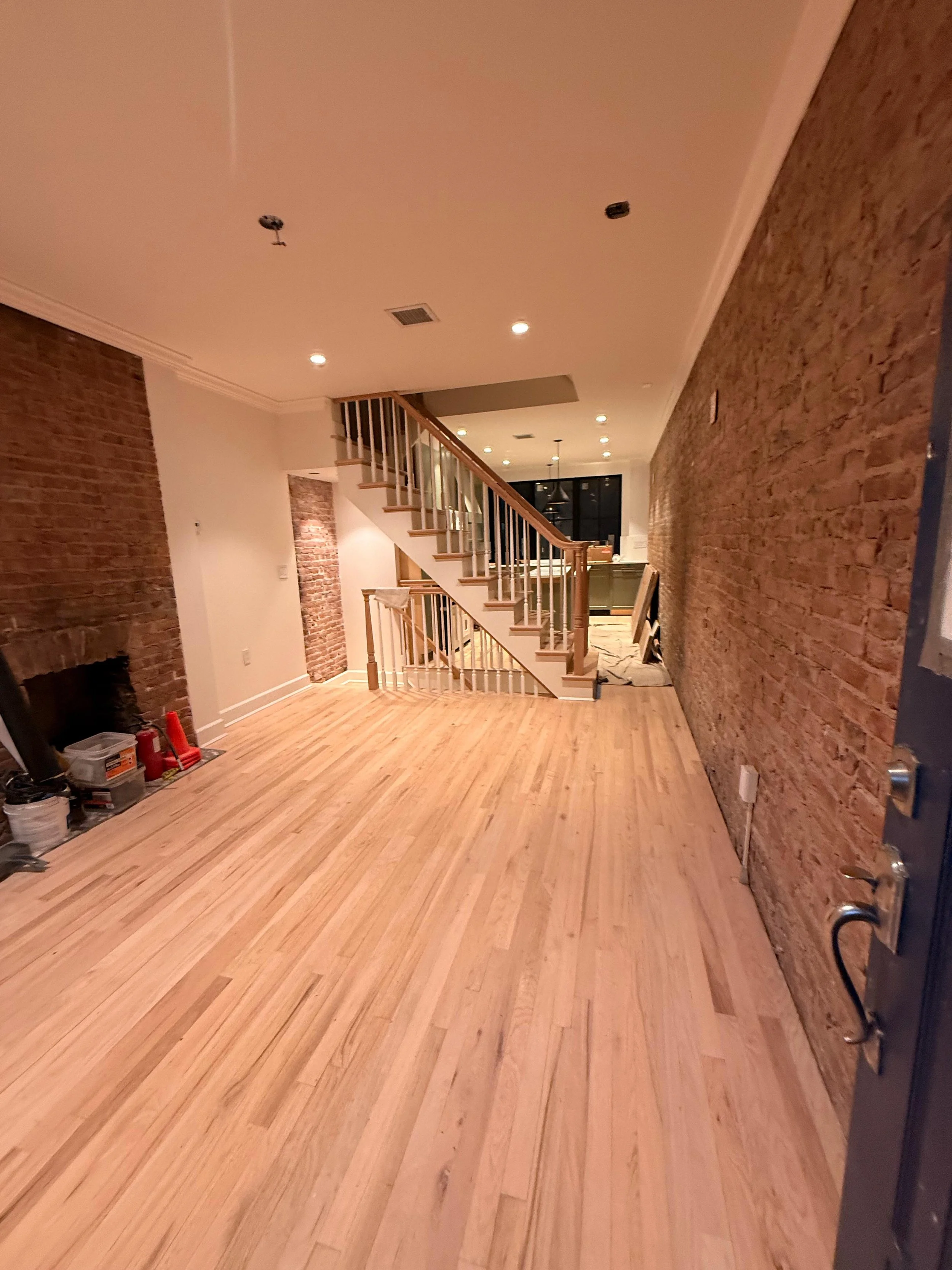 Restored historic stairs and hardwood flooring installation