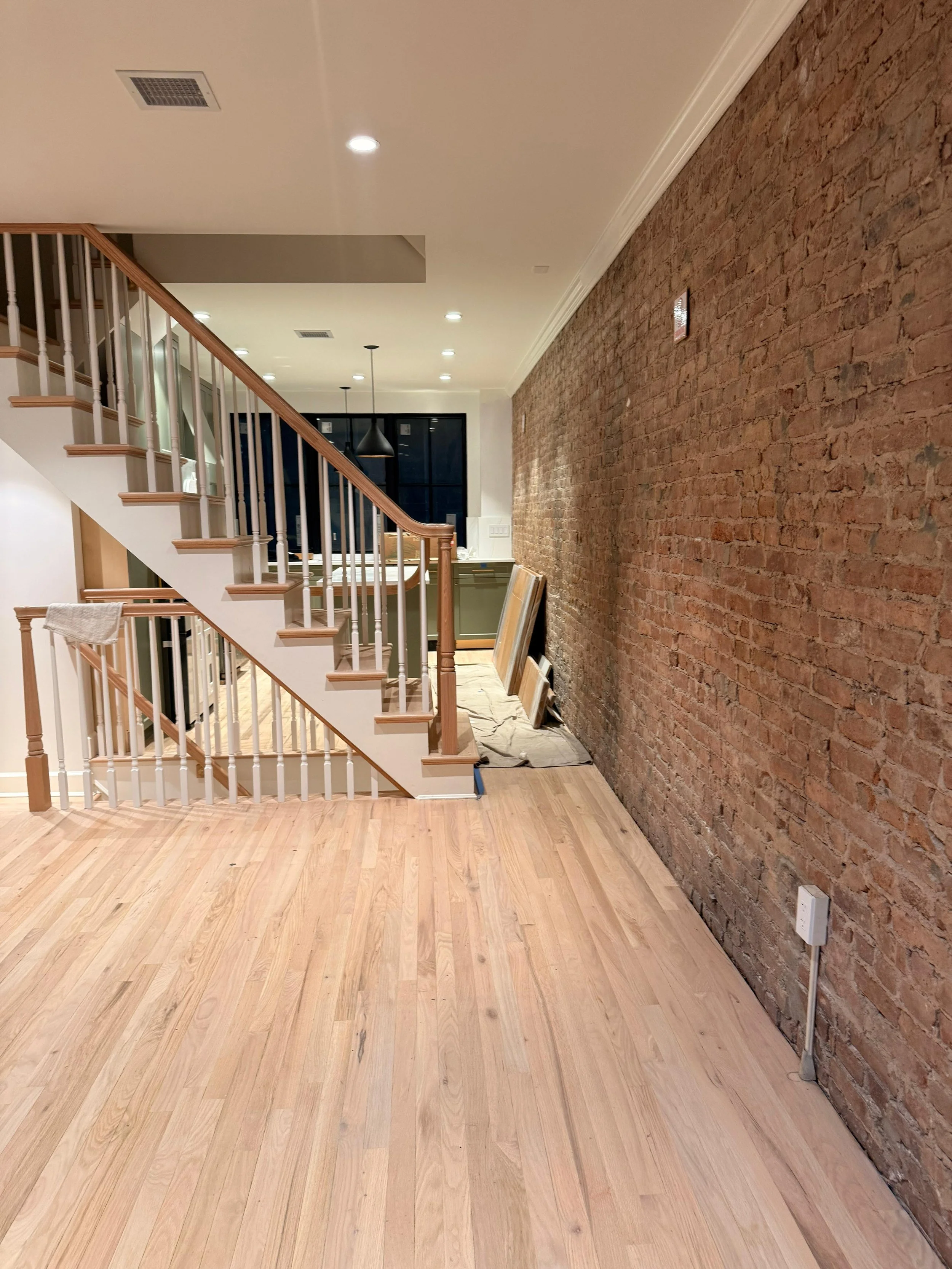 Restored historic stairs and hardwood flooring installation