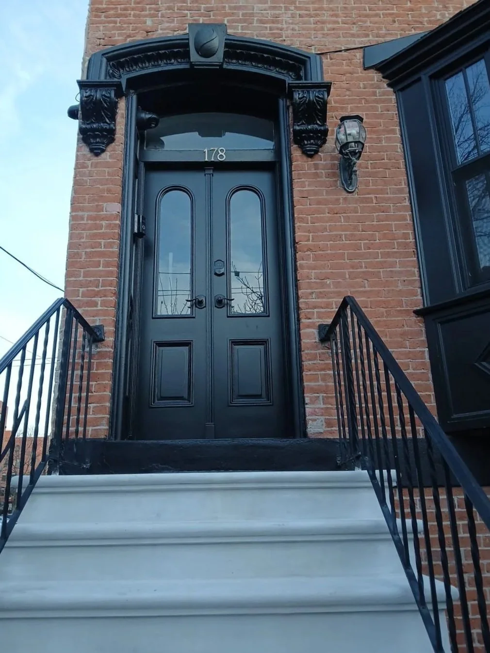 Historic door and bay window replacement with restoration of all original mouldings/trim work